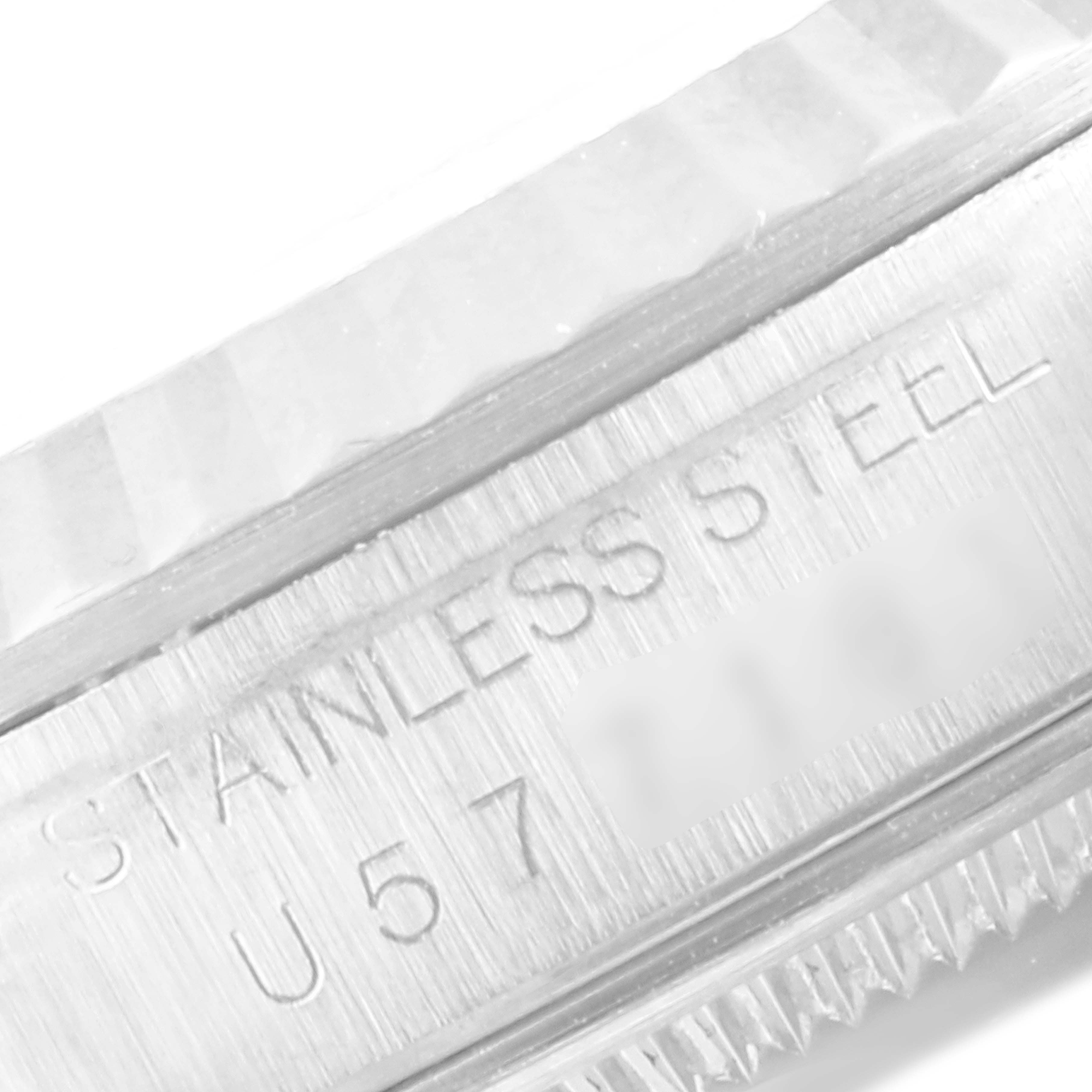 The image shows a close-up of the stainless steel case with the serial number engraved on a Rolex Datejust 16234 Men's Stainless Steel Silver Dial 16234 Men's Stainless Steel Silver Dial watch.