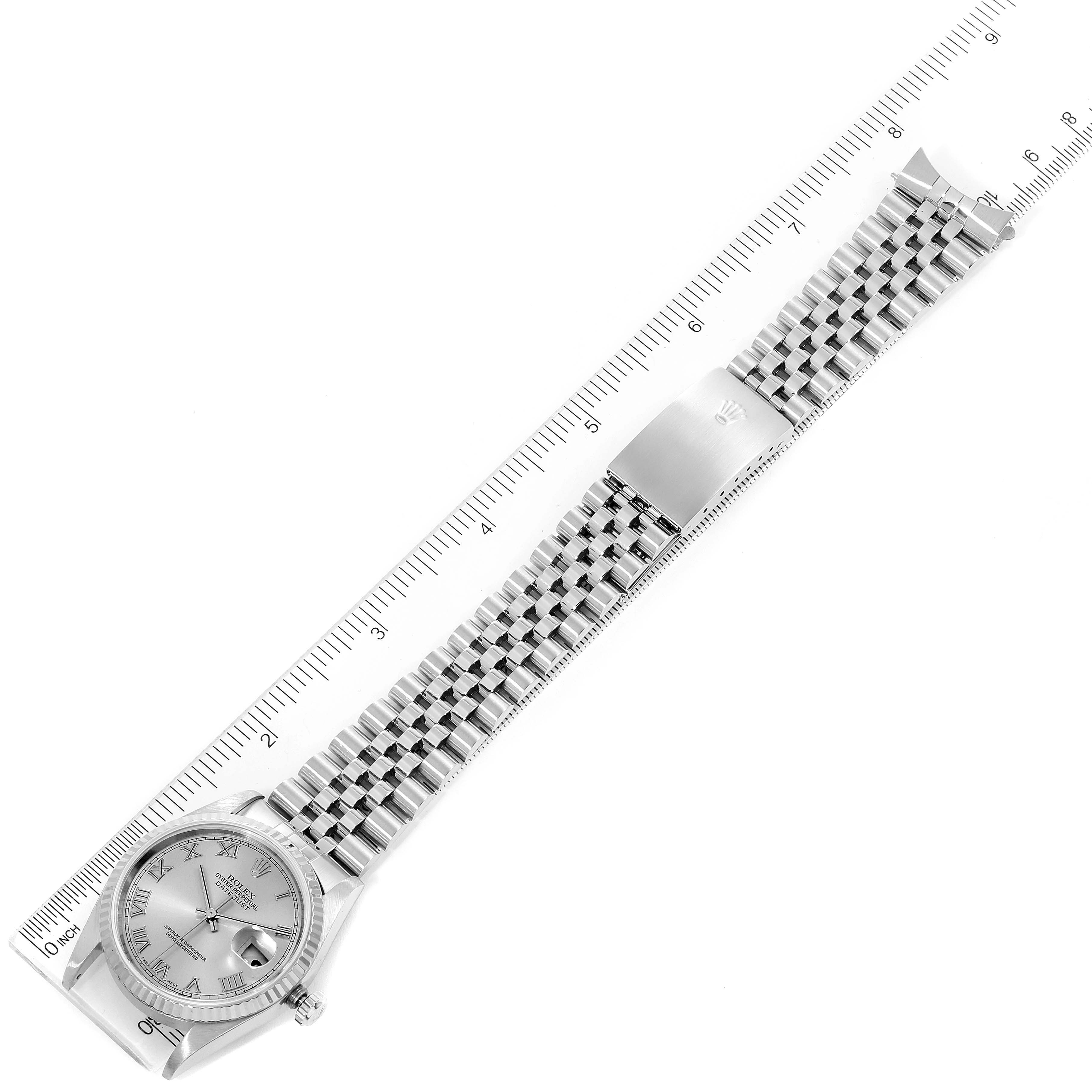 The image shows a top-down view of a Rolex Datejust 16234 Men's Stainless Steel Silver Dial 16234 Men's Stainless Steel Silver Dial watch, displaying the watch face and entire bracelet with a ruler alongside.