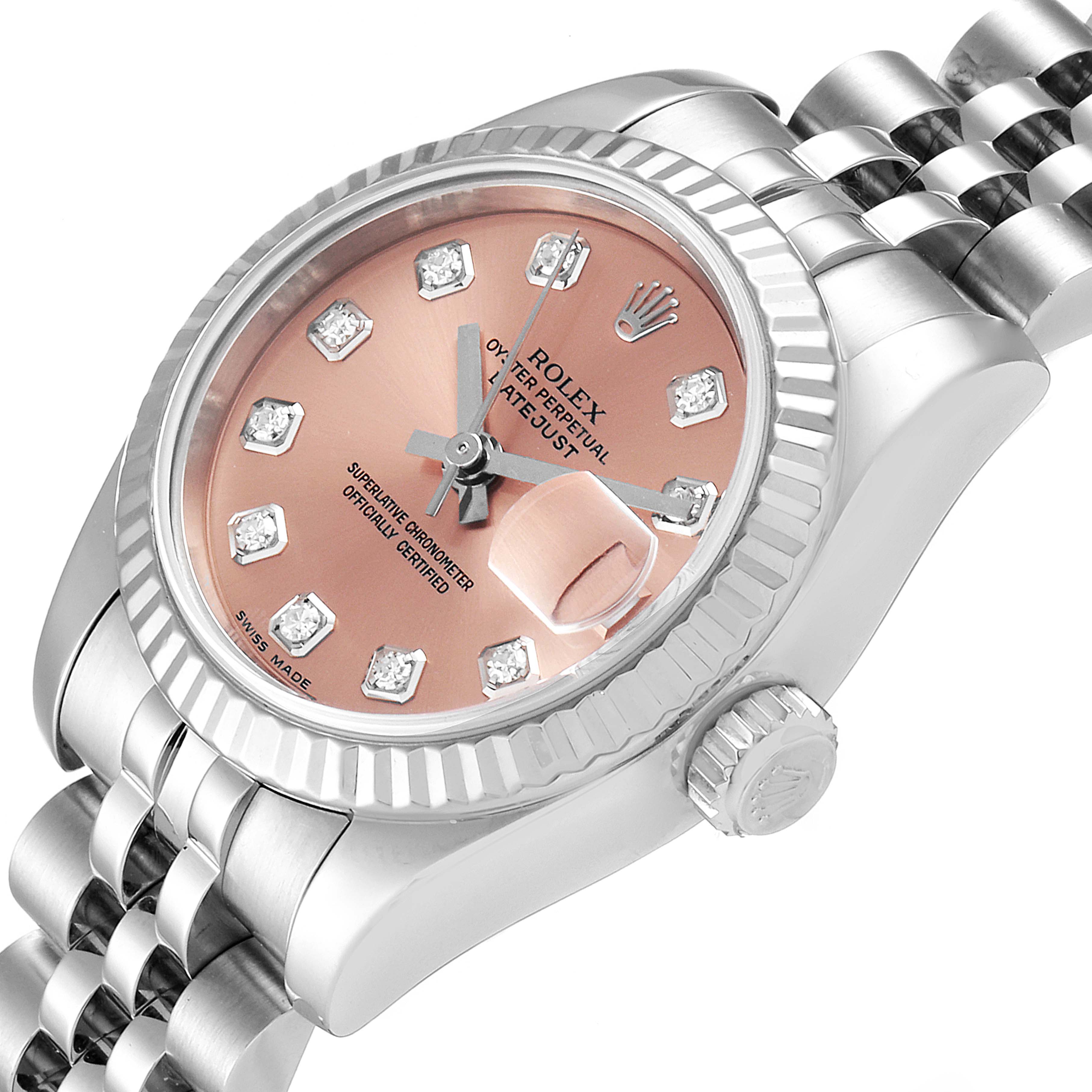 This image shows a close-up view of a Rolex Datejust 179174 Women's Stainless Steel Pink Dial 179174 Women's Stainless Steel Pink Dial watch, highlighting its face, bezel, and bracelet.