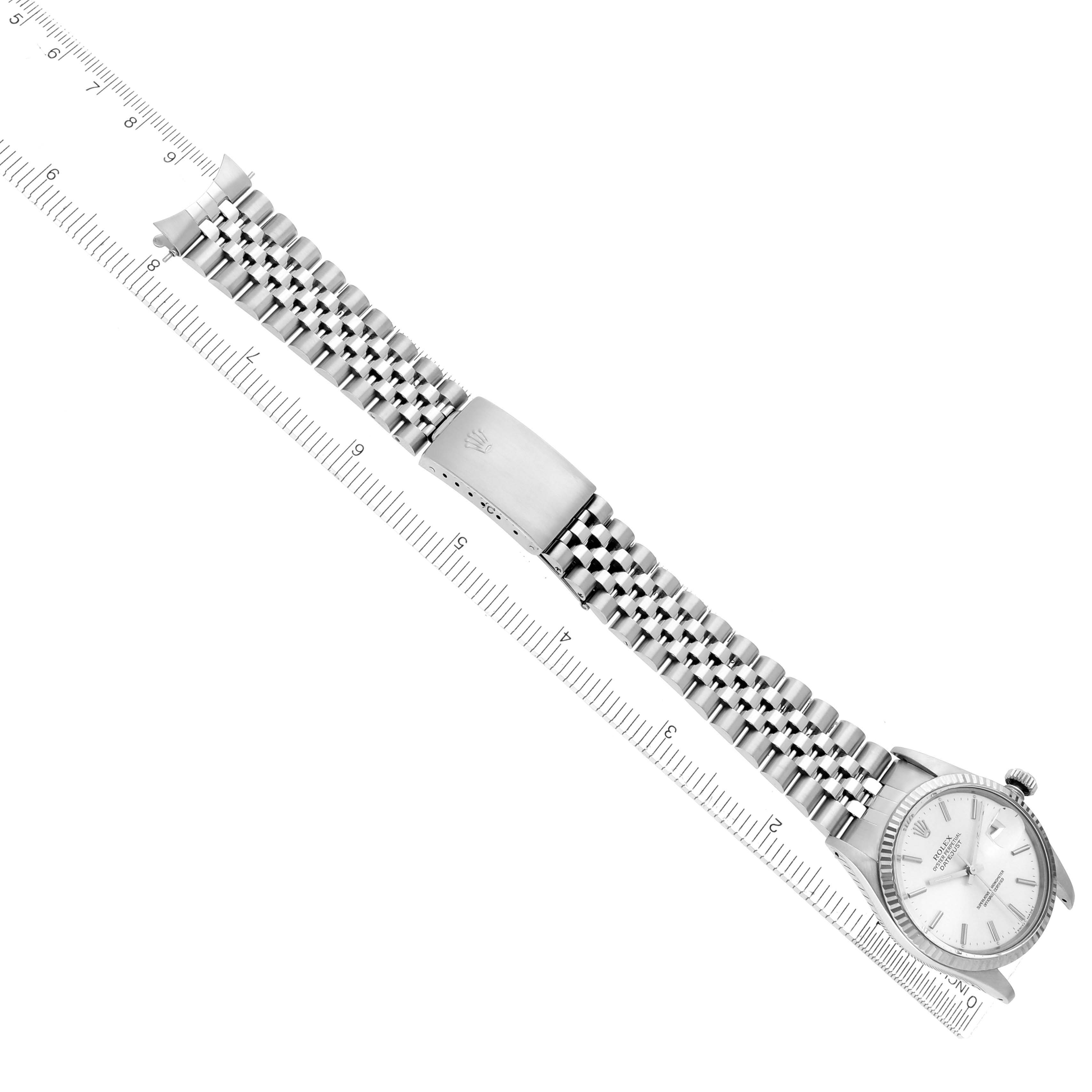 The image shows a Rolex Vintage Collection model 16014 men
s watch at an angle with the full bracelet and face visible, laid next to a ruler for scale.