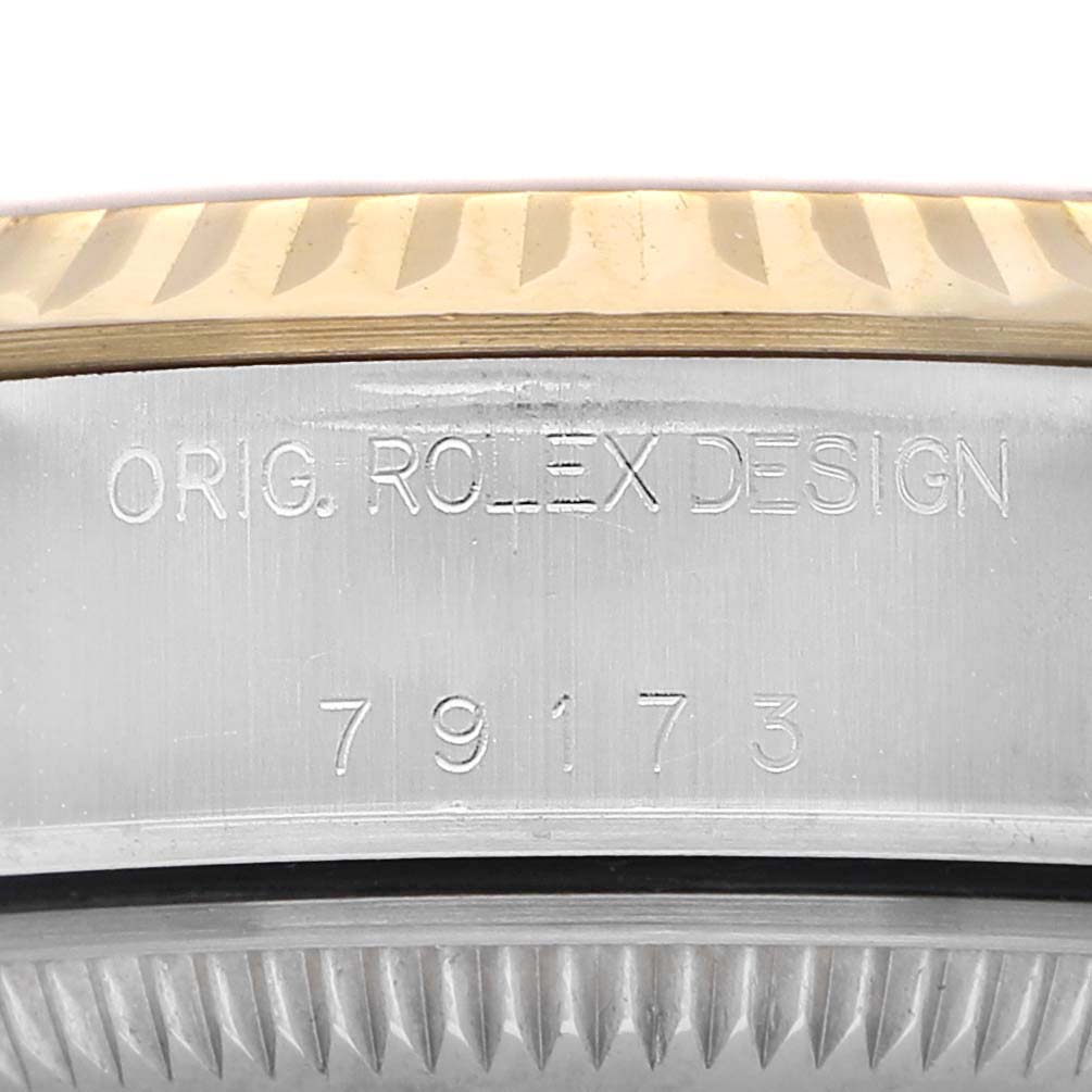The image shows the side engraving on the case of a Rolex Datejust 79173 Women's Stainless Steel Champagne Dial watch, featuring "ORIG. ROLEX DESIGN" and the model number.