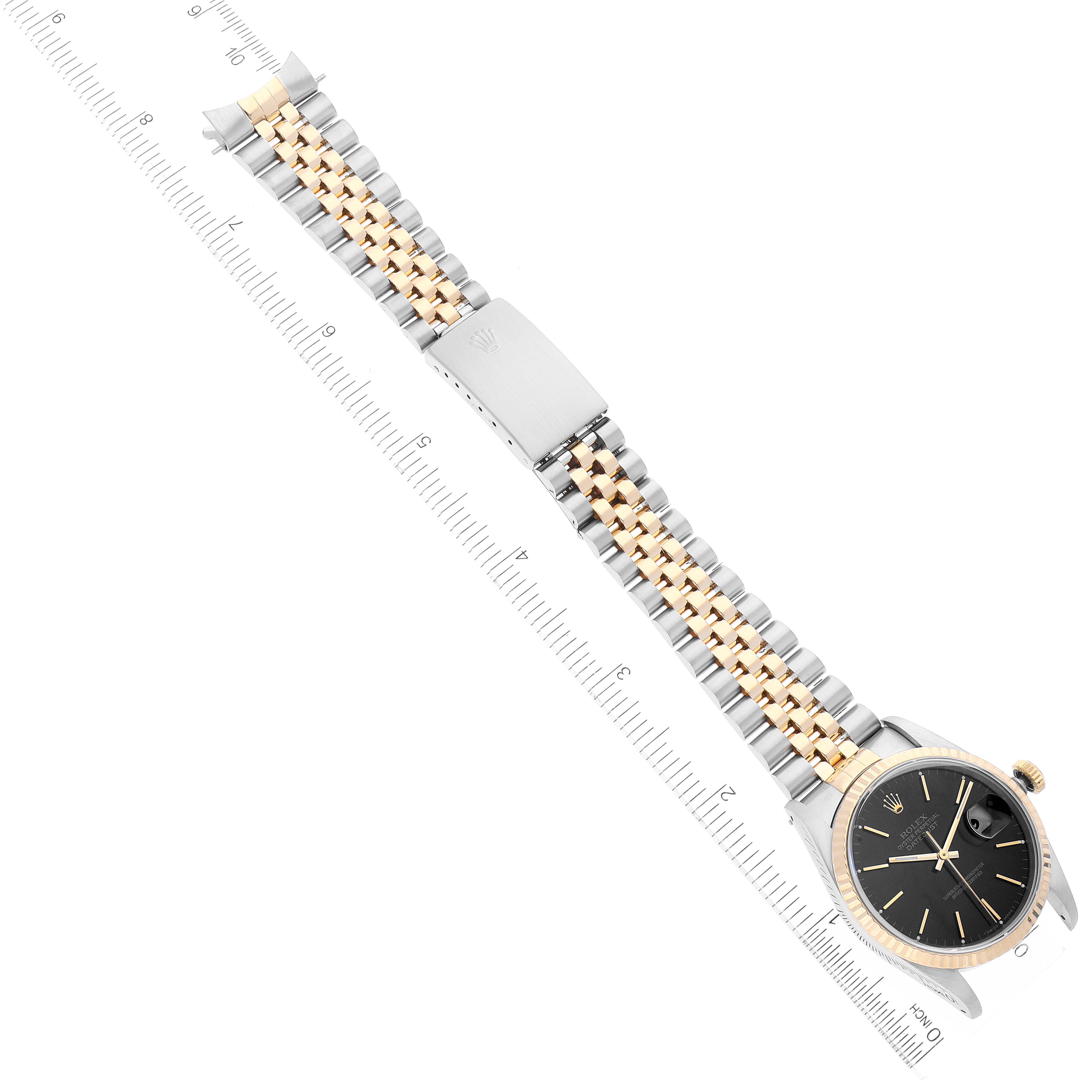 The image shows a Rolex Datejust 16233 Men's Steel and Gold (two tone) Black Dial 16233 Men's Steel and Gold (two tone) Black Dial watch laid flat, highlighting the face, bezel, and two-tone bracelet with a clasp.