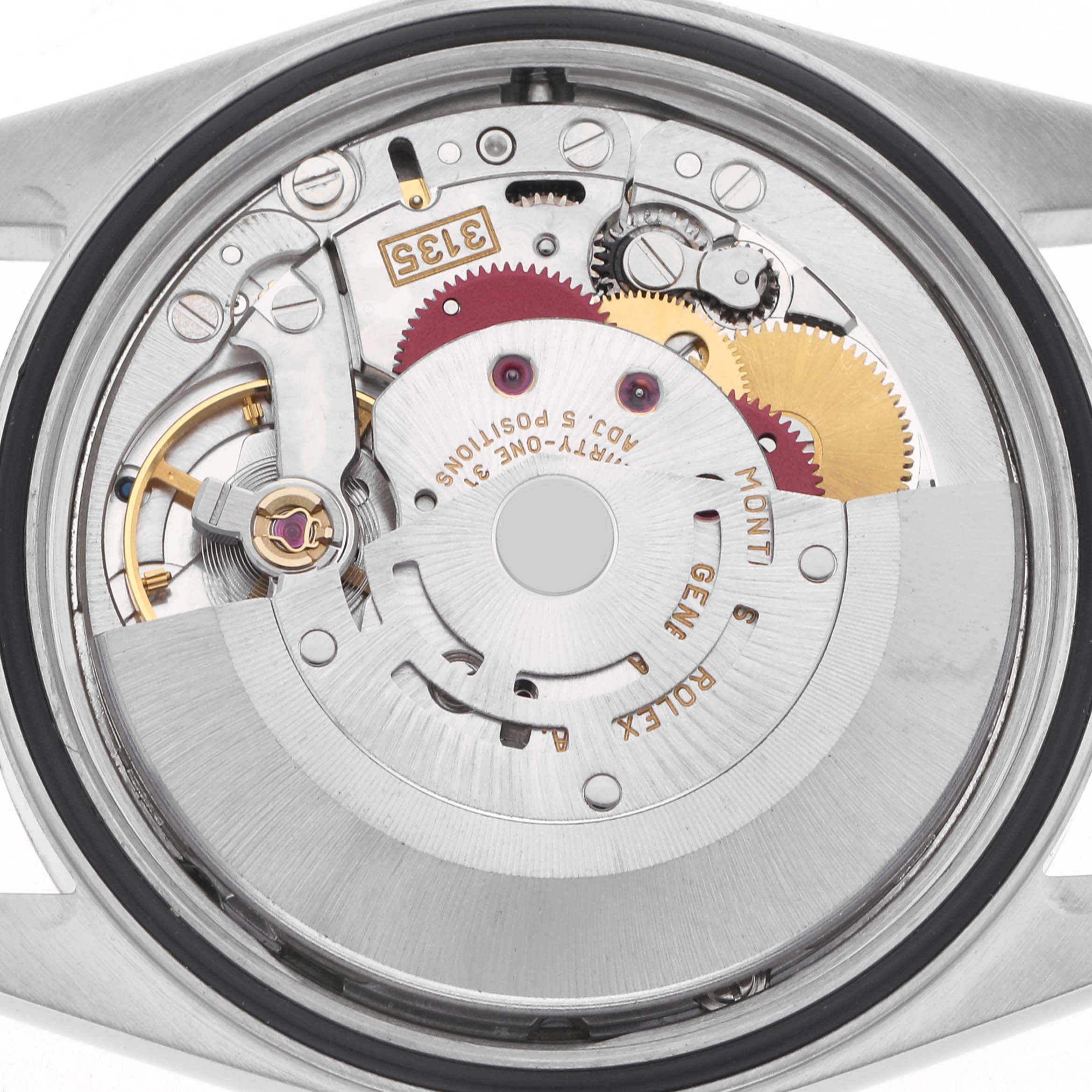 The image shows the movement of a Rolex Datejust model 16233 men
s watch, viewed from the backside with internal components like gears and rotor visible.