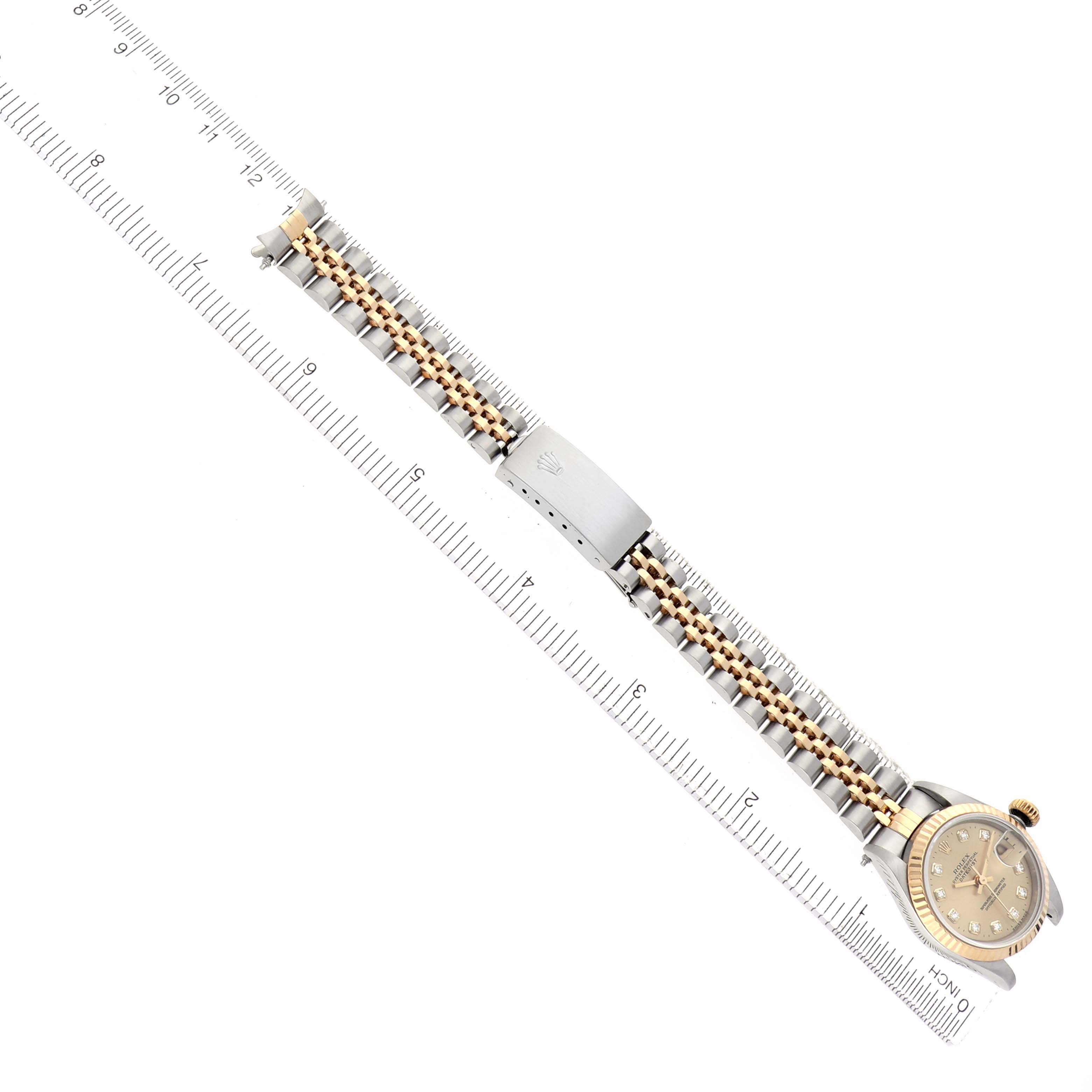 The image shows the Rolex Datejust model 69173 from a top-down angle, featuring the full length of the bracelet and the watch face.