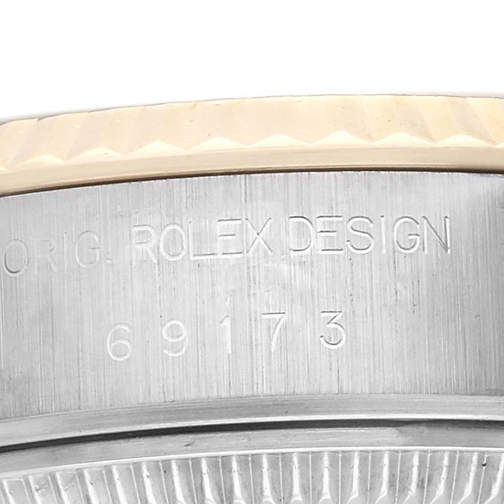 The image shows a close-up side view of the Rolex Datejust model 69173, highlighting the engraved model number and "ORIG. ROLEX DESIGN" on the case.