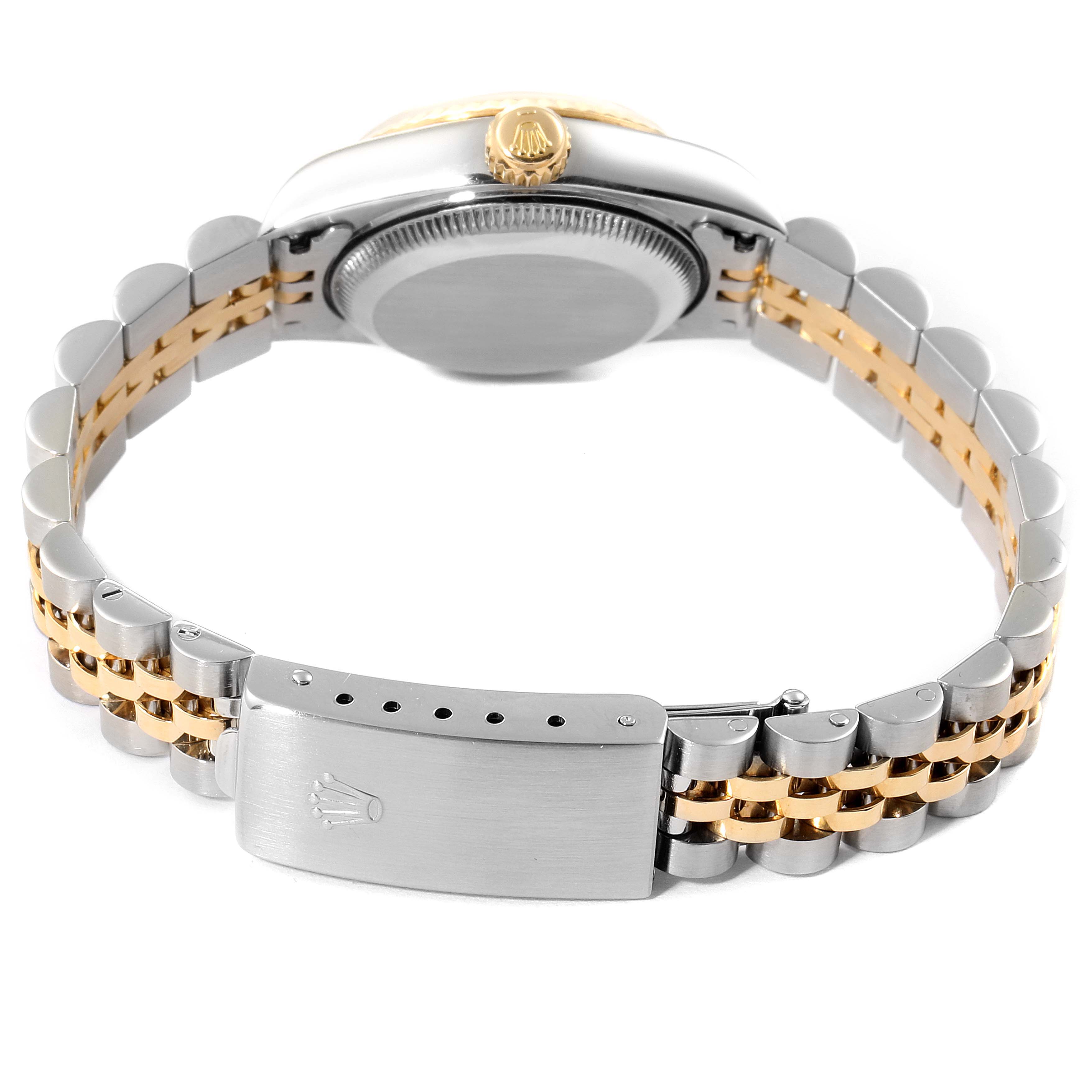 The image depicts the back of the Rolex Datejust 79173 Women
s Steel and Gold (two tone) Silver Dial 79173 Women
s Steel and Gold (two tone) Silver Dial watch, showcasing its band and clasp.