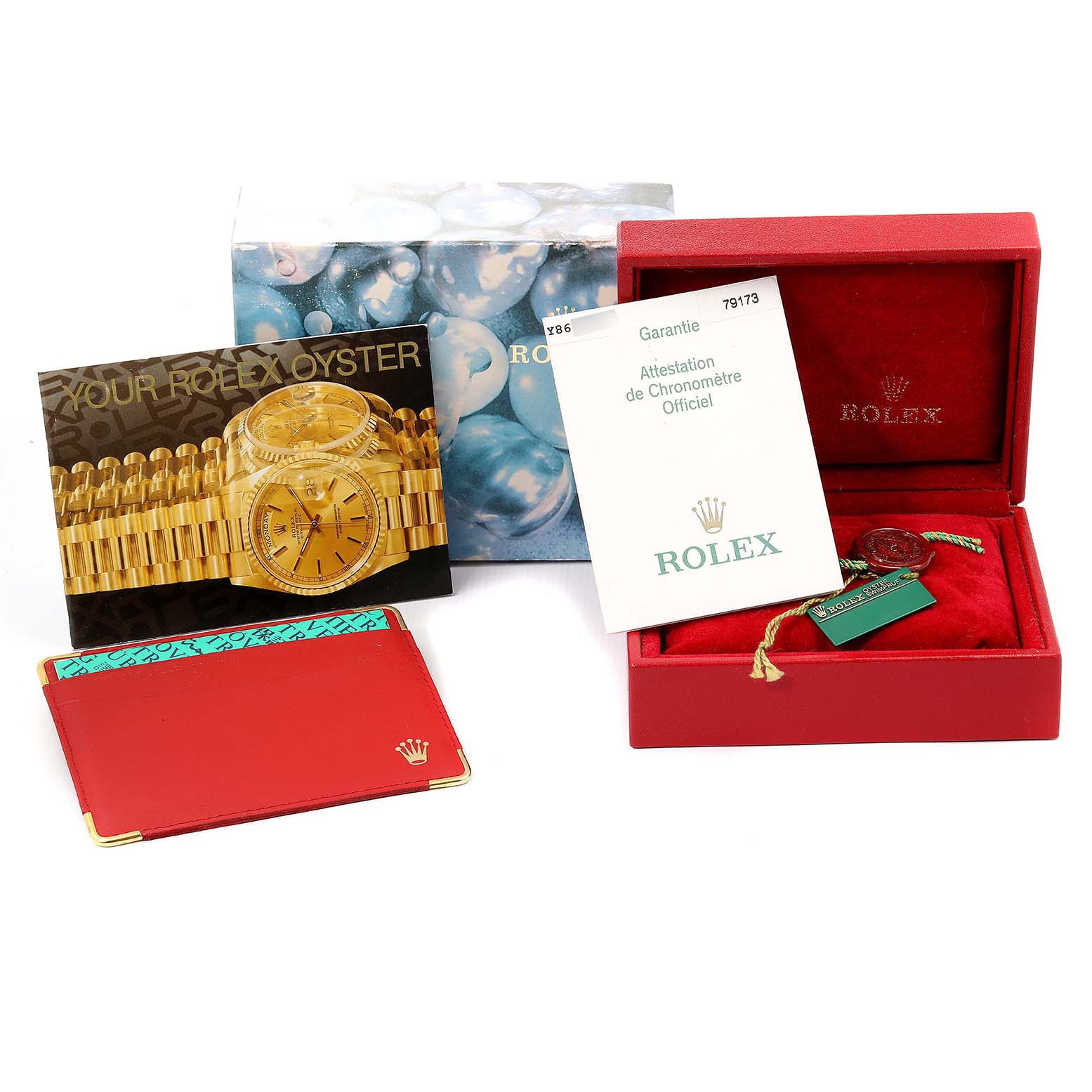The image shows accessories for a Rolex Datejust 79173 Women
s Steel and Gold (two tone) Silver Dial 79173 Women
s Steel and Gold (two tone) Silver Dial model, including a presentation box, booklet, tags, and a card holder.