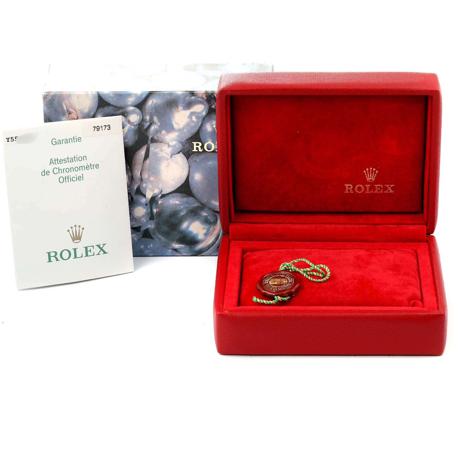 The image shows a Rolex Datejust 79173 Women
s Steel and Gold (two tone) Grey Dial 79173 Women
s Steel and Gold (two tone) Grey Dial watch
s red presentation box, warranty card, and tag accessories at eye level.