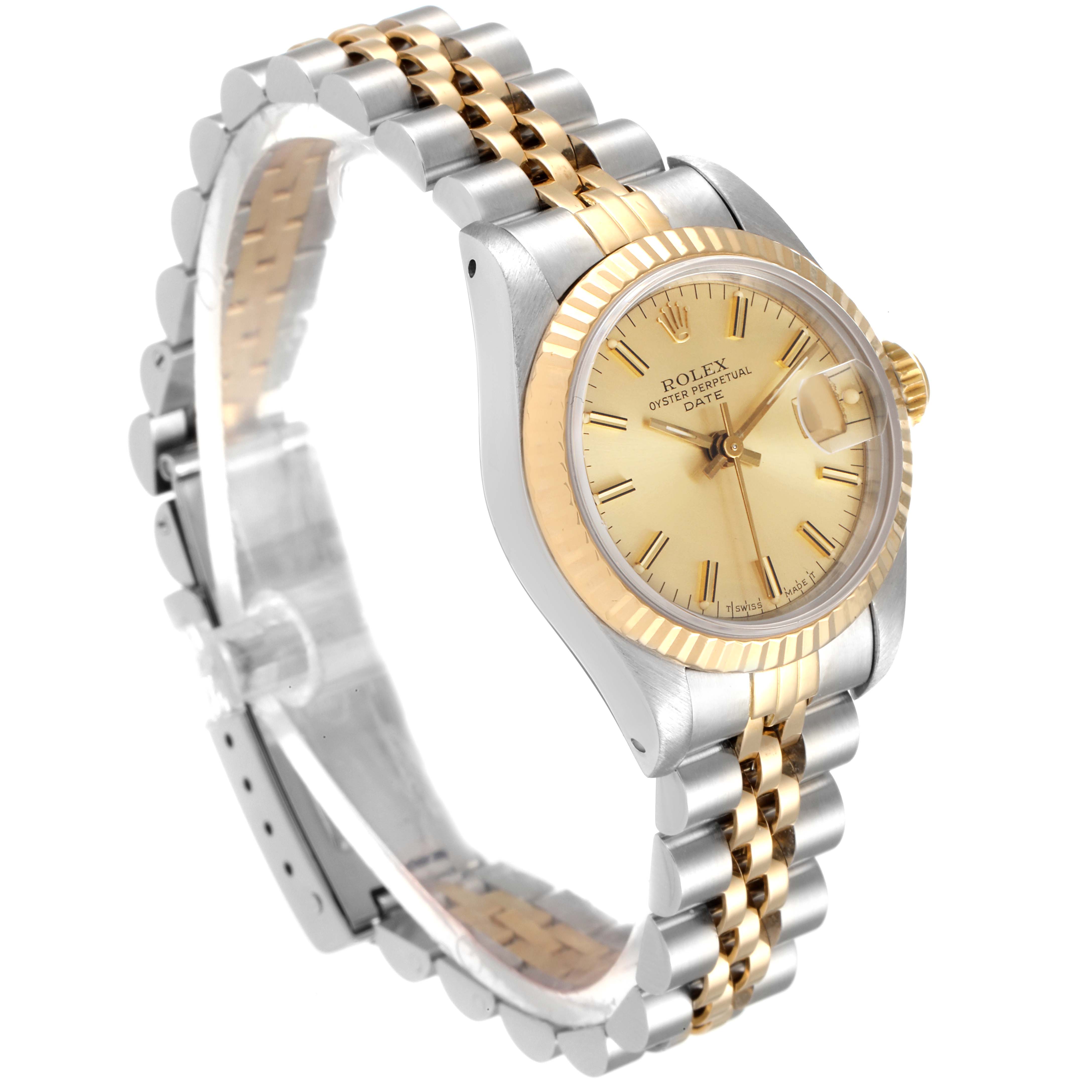 The Rolex Datejust 69173 Women
s Steel and Gold (two tone) Champagne Dial 69173 Women
s Steel and Gold (two tone) Champagne Dial watch is shown at an angle highlighting its case, gold bezel, and two-tone jubilee bracelet.