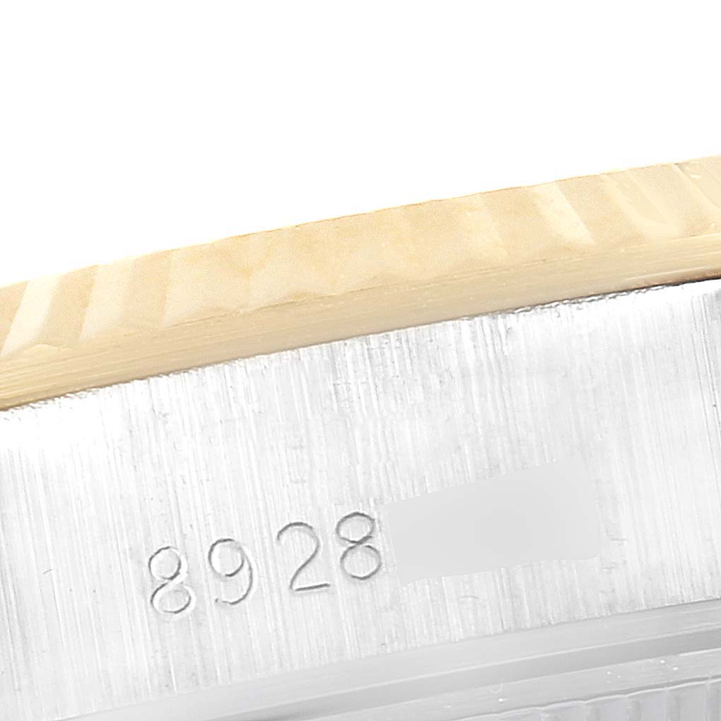 The image shows a close-up angle of the serial number on the side of the Rolex Datejust 69173 Women
s Steel and Gold (two tone) Champagne Dial 69173 Women
s Steel and Gold (two tone) Champagne Dial watch case.