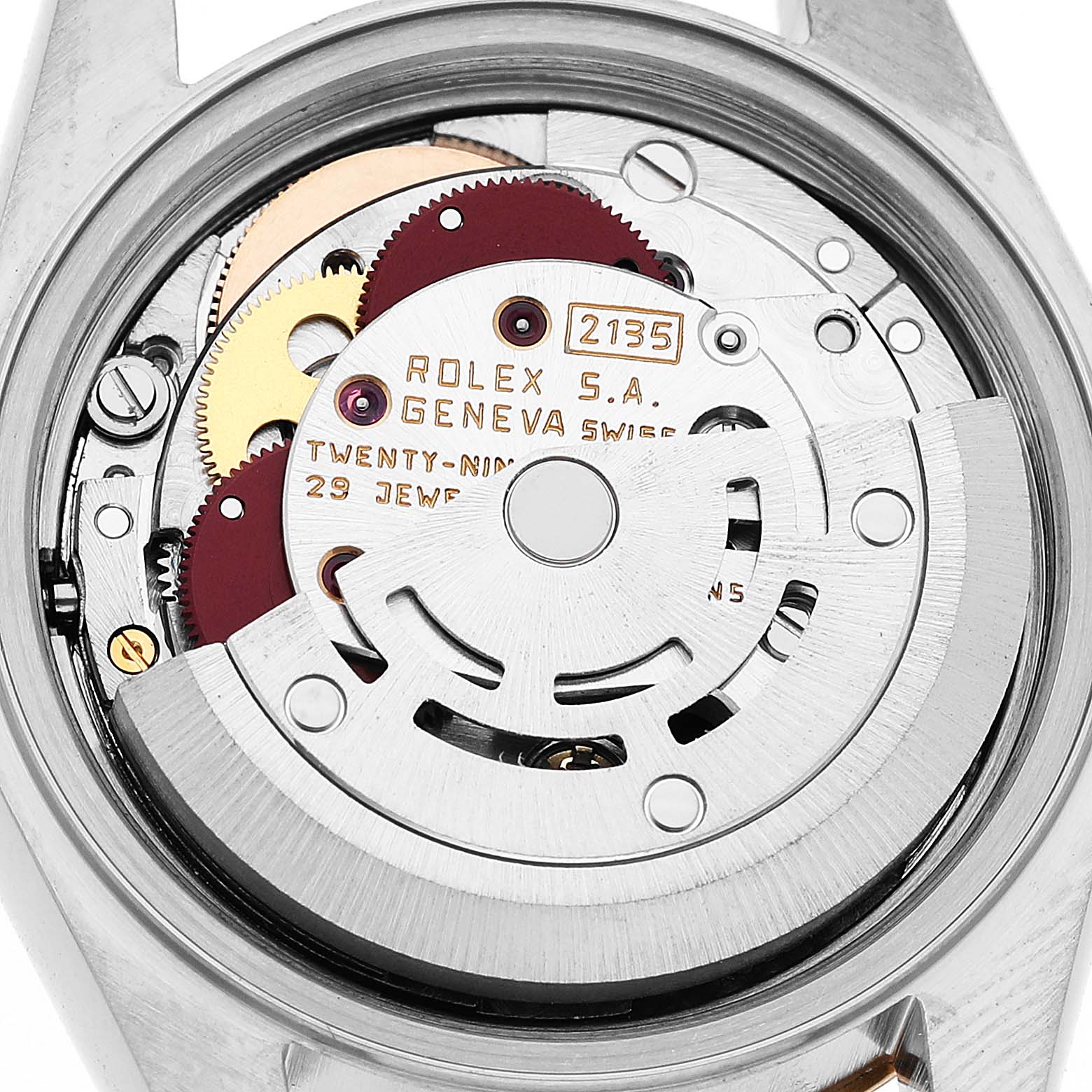 The image shows the movement of a Rolex Datejust 79173 Women's Steel and Gold (two tone) White Dial model viewed from the back, highlighting its intricate mechanisms and engravings.