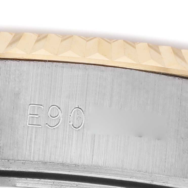 The image shows a close-up of the Rolex Datejust 69173 Women's Stainless Steel White Dial's fluted bezel and part of the engraved watch case.