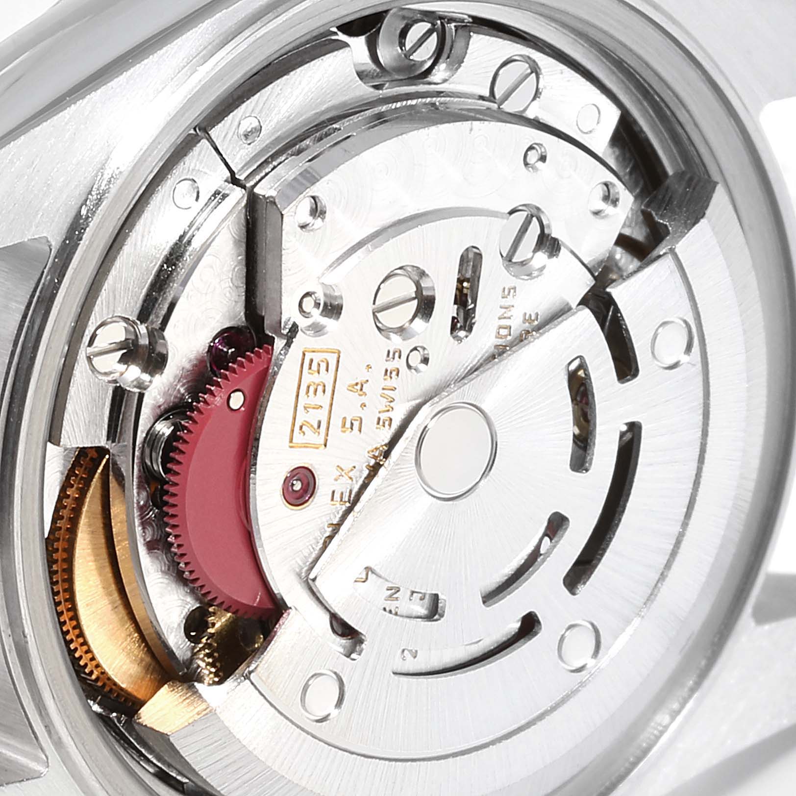 Close-up of the Rolex Datejust 69173 Women
s Steel and Gold (two tone) Champagne Dial 69173 Women
s Steel and Gold (two tone) Champagne Dial watch
s movement, showing intricate gears, rotors, and other internal components.
