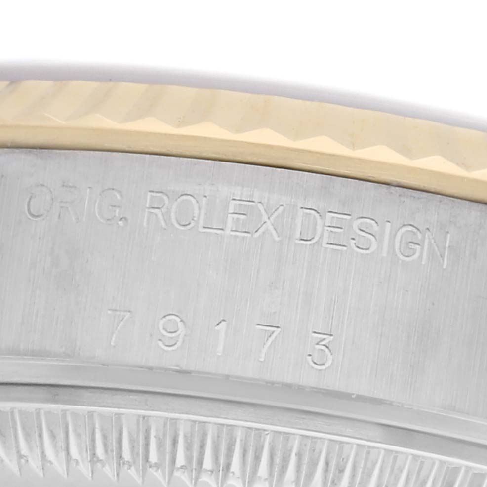 The image shows a close-up of the side of a Rolex Datejust watch, model 79173, featuring the engraved "ORIG. ROLEX DESIGN" and the model number.