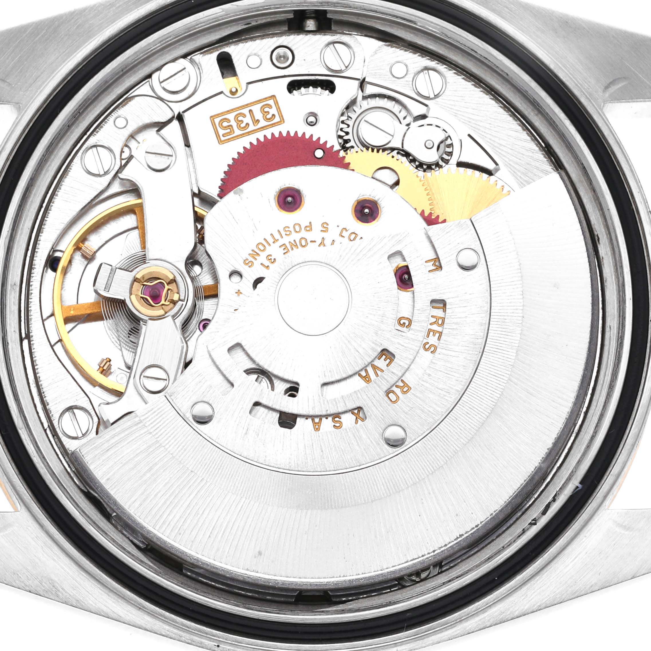 The image shows the movement of a Rolex Datejust model 16233, photographed from the back, highlighting the intricate gears and components.