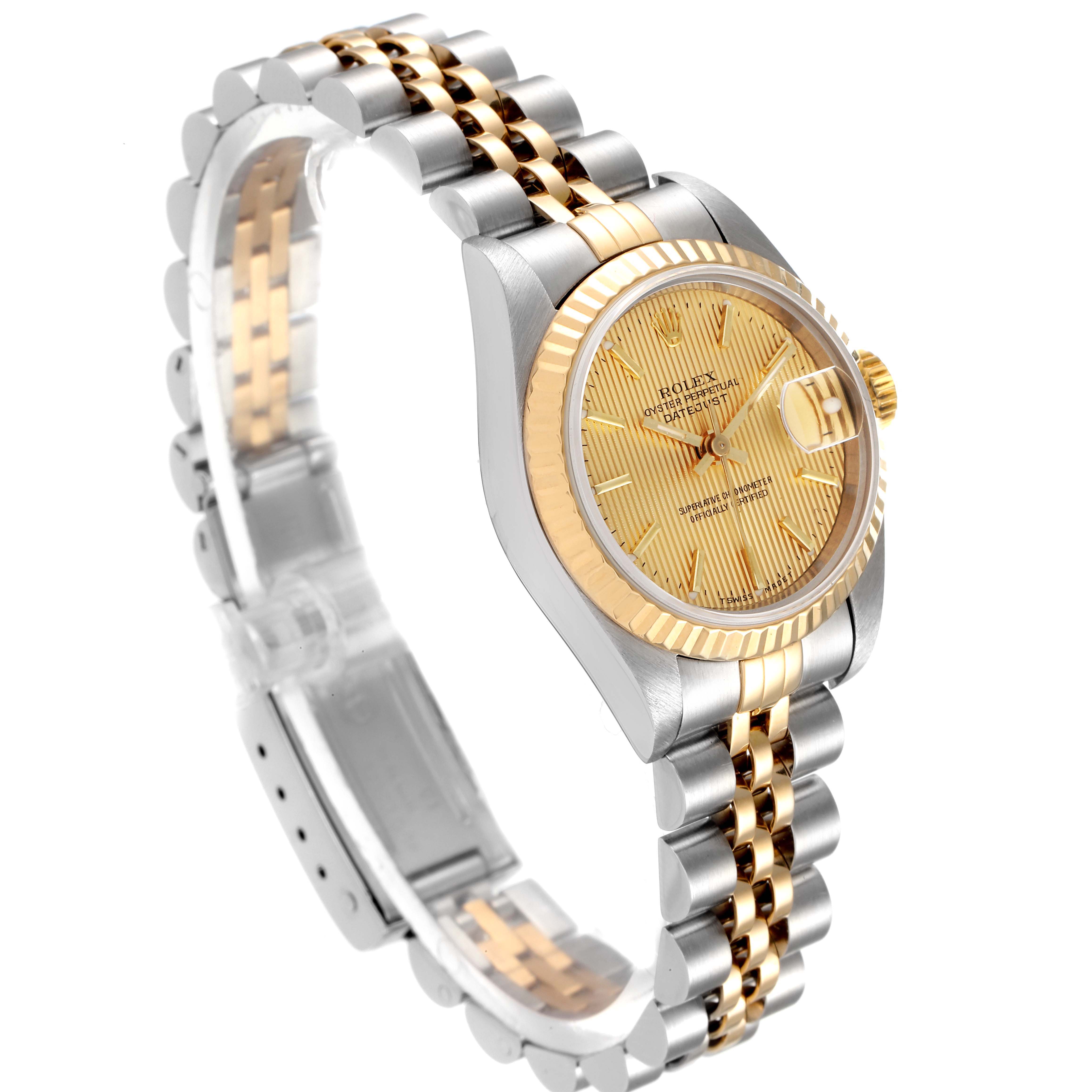 This image shows a Rolex Datejust 69173 Women's Steel and Gold (two tone) Champagne Dial 69173 Women's Steel and Gold (two tone) Champagne Dial watch at a three-quarter angle, highlighting its gold dial, fluted bezel, and two-tone bracelet.