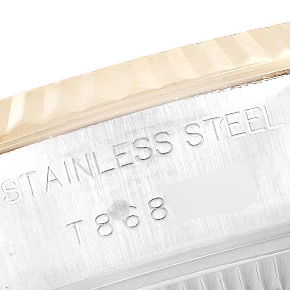 This close-up image shows the engraved wording on the side of a stainless steel Rolex Datejust 69173 Women's Steel and Gold (two tone) Champagne Dial 69173 Women's Steel and Gold (two tone) Champagne Dial watch.