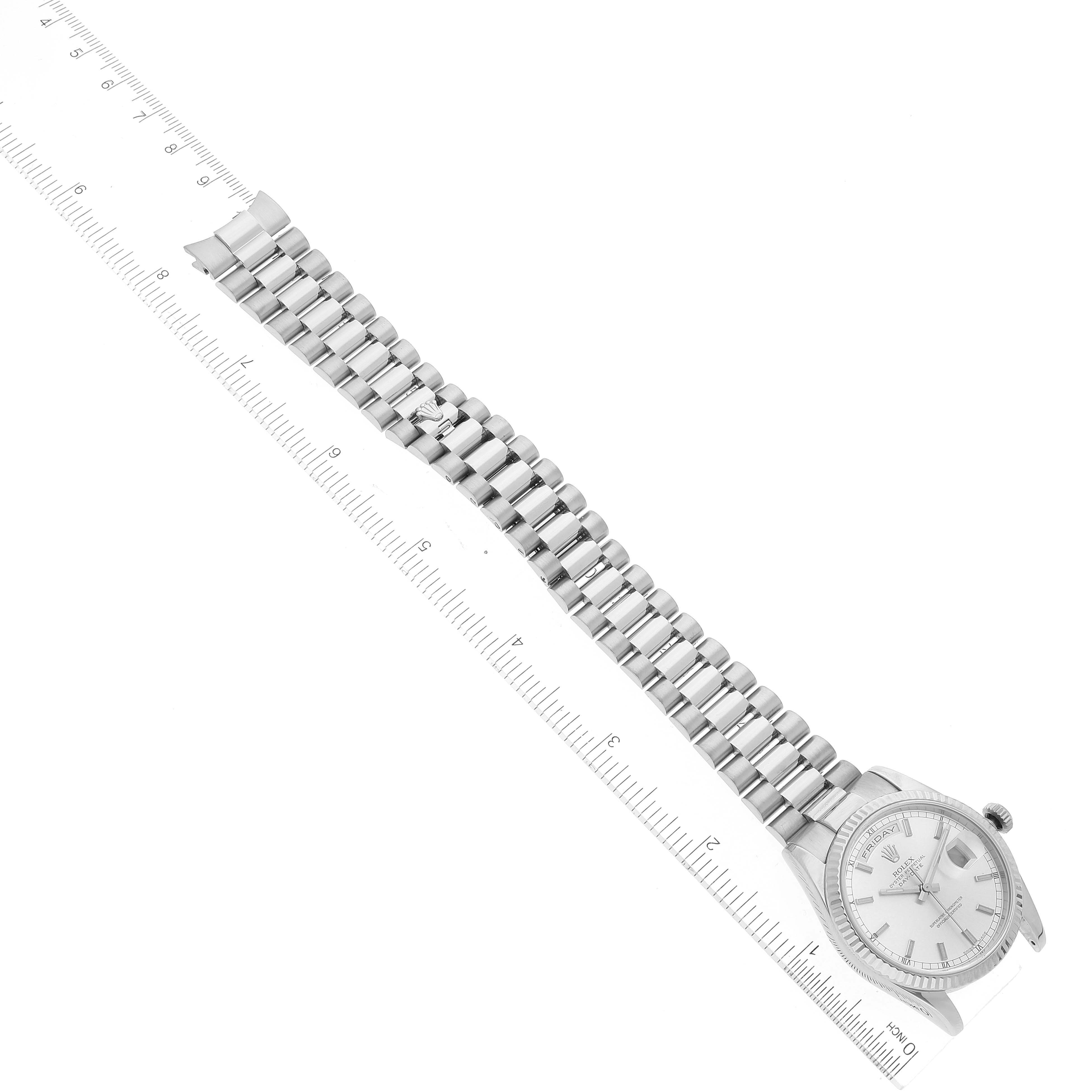 The image shows a top view of a Rolex President 118239 Men's White Gold Silver Dial 118239 Men's White Gold Silver Dial model watch with its bracelet fully extended next to a ruler.