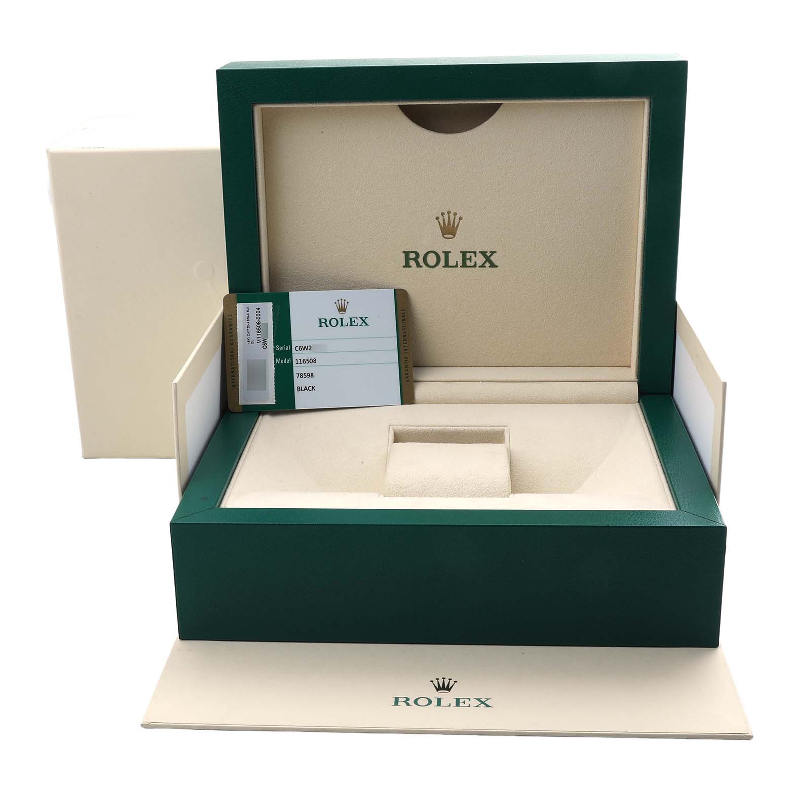 The image shows an open Rolex watch box for the Daytona model, displaying the interior and a warranty card.