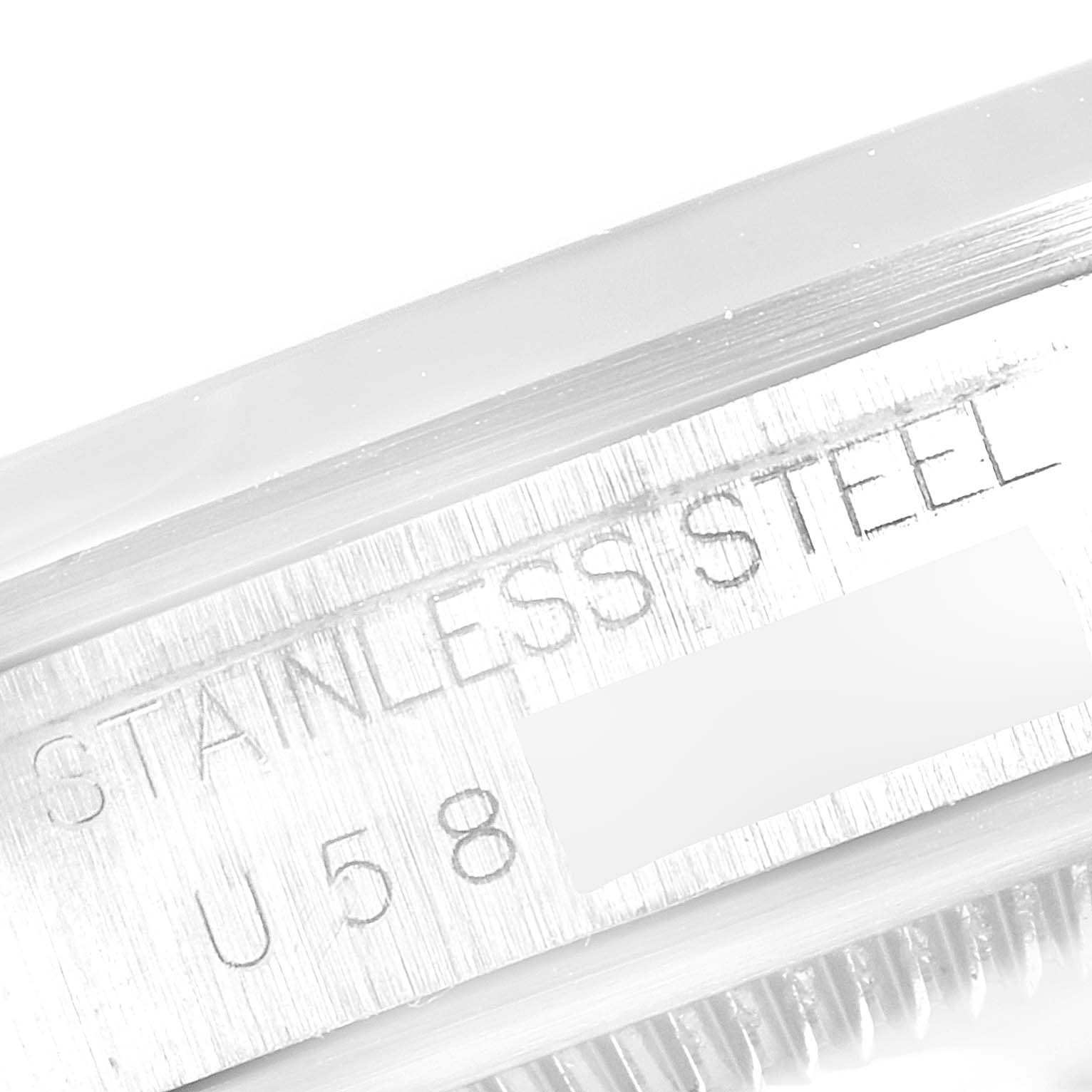 This image shows a close-up of the stainless steel inscription and serial number on the side of a Rolex Explorer 14270 Men
s Stainless Steel Black Dial 14270 Men
s Stainless Steel Black Dial watch.