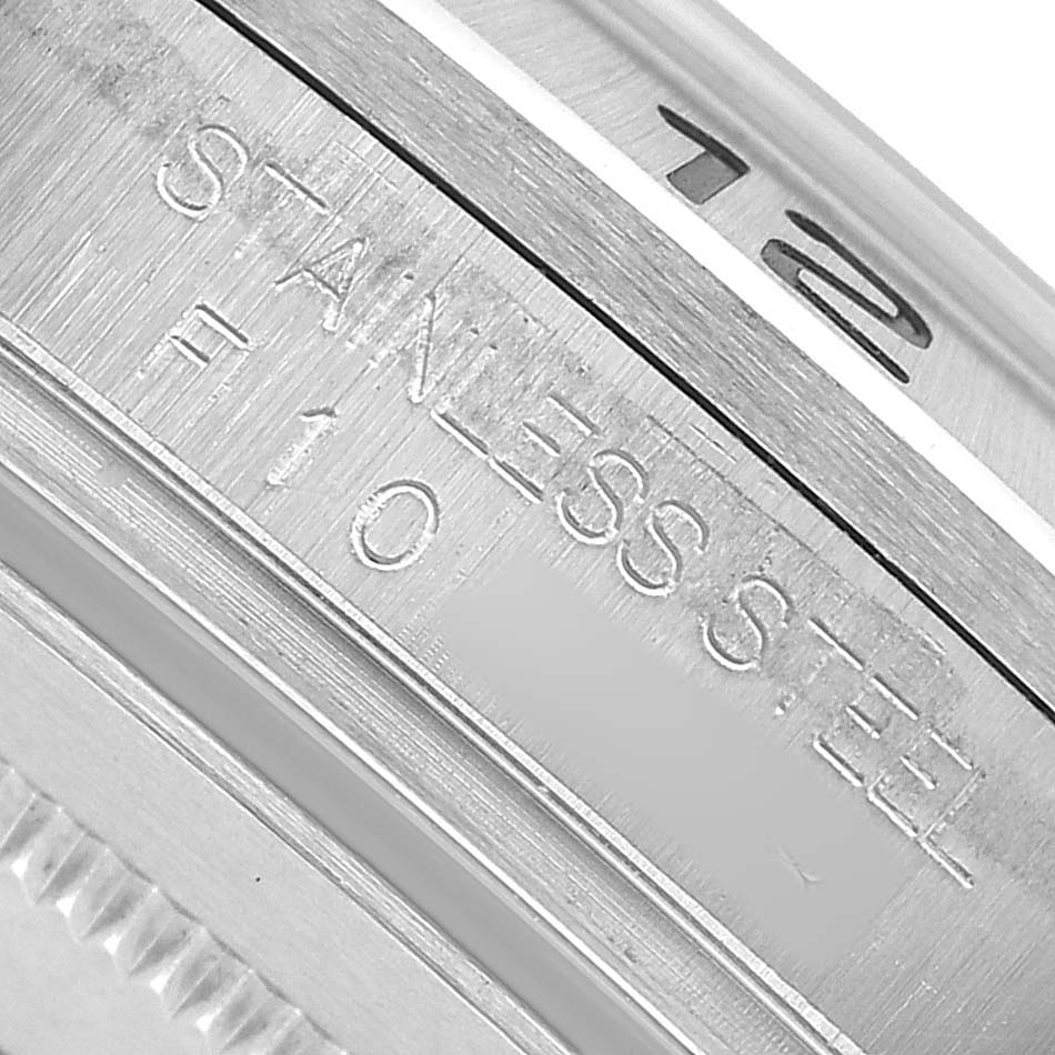 The image shows the side engraving on the stainless steel case of a Rolex Explorer 16570 Men's Stainless Steel White Dial watch.