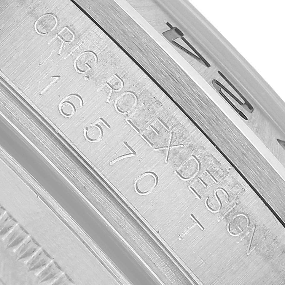 The image shows a close-up view of the case side engraving on a Rolex Explorer 16570 Men's Stainless Steel White Dial, highlighting the "ORIG ROLEX DESIGN" and model number.