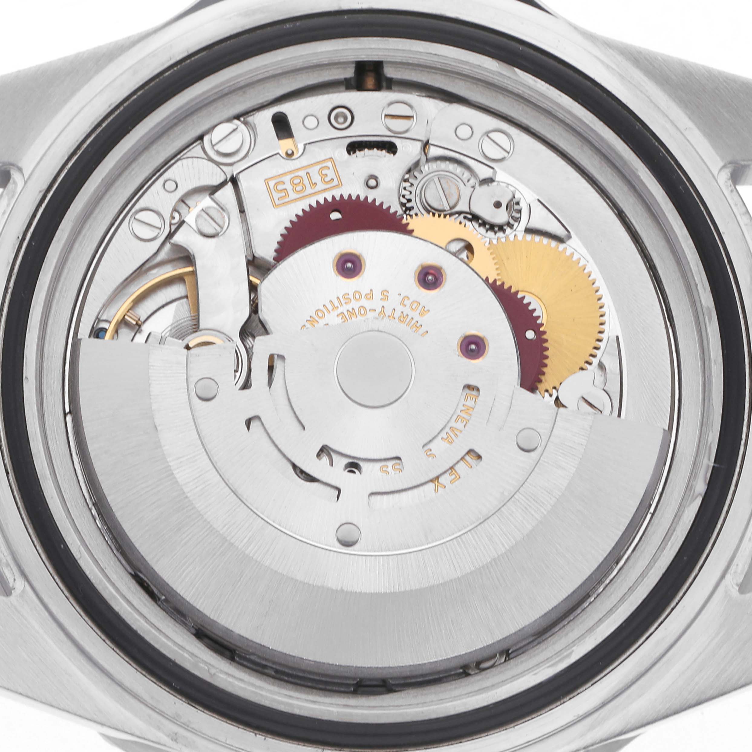 The image shows the movement and internal mechanics of a Rolex GMT-Master model 16710, focusing on the rotor and gears, viewed from the back.