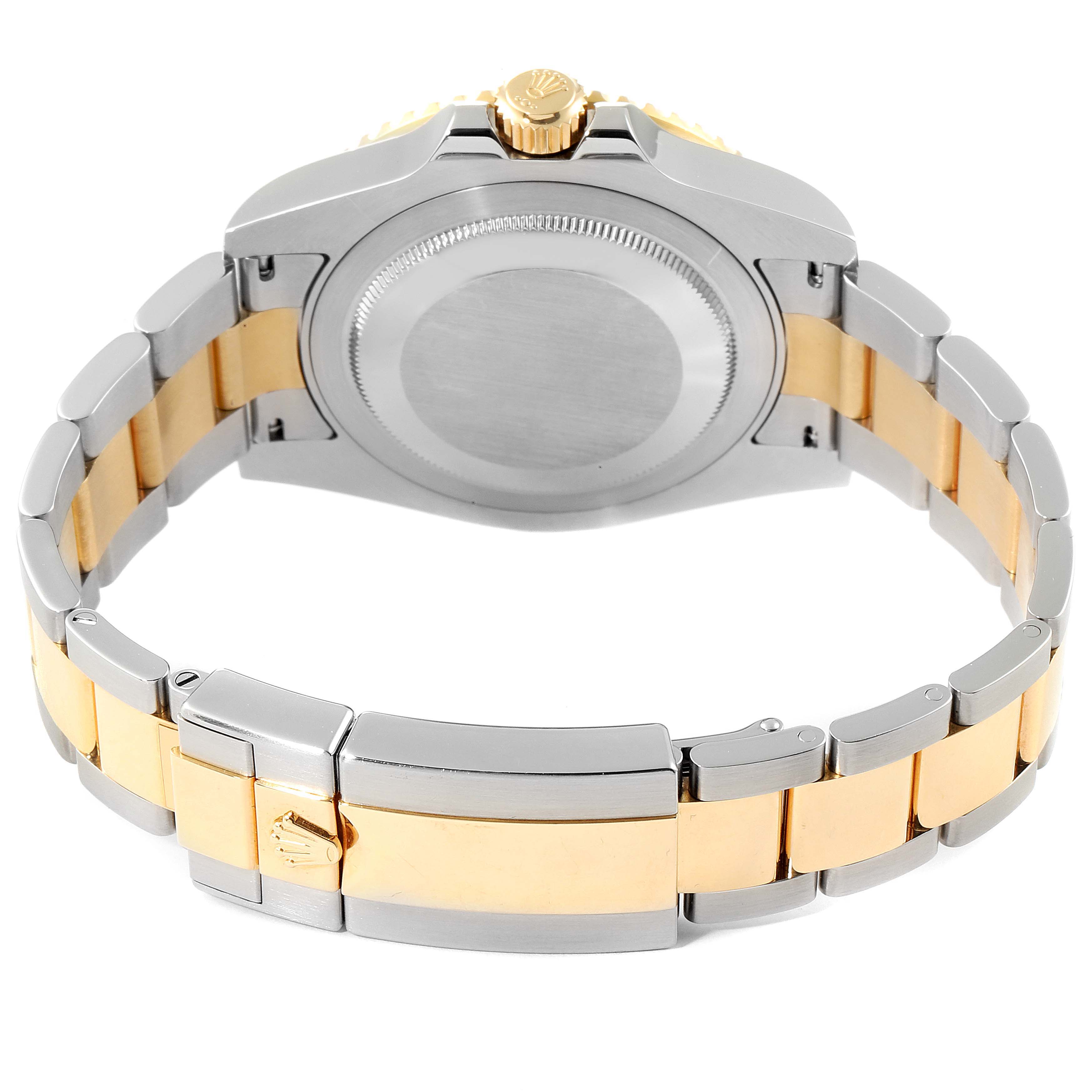 The image shows the back of a Rolex GMT-Master 116713 Men's Steel and Gold (two tone) Black Dial 116713 Men's Steel and Gold (two tone) Black Dial watch, highlighting its two-tone bracelet and clasp.