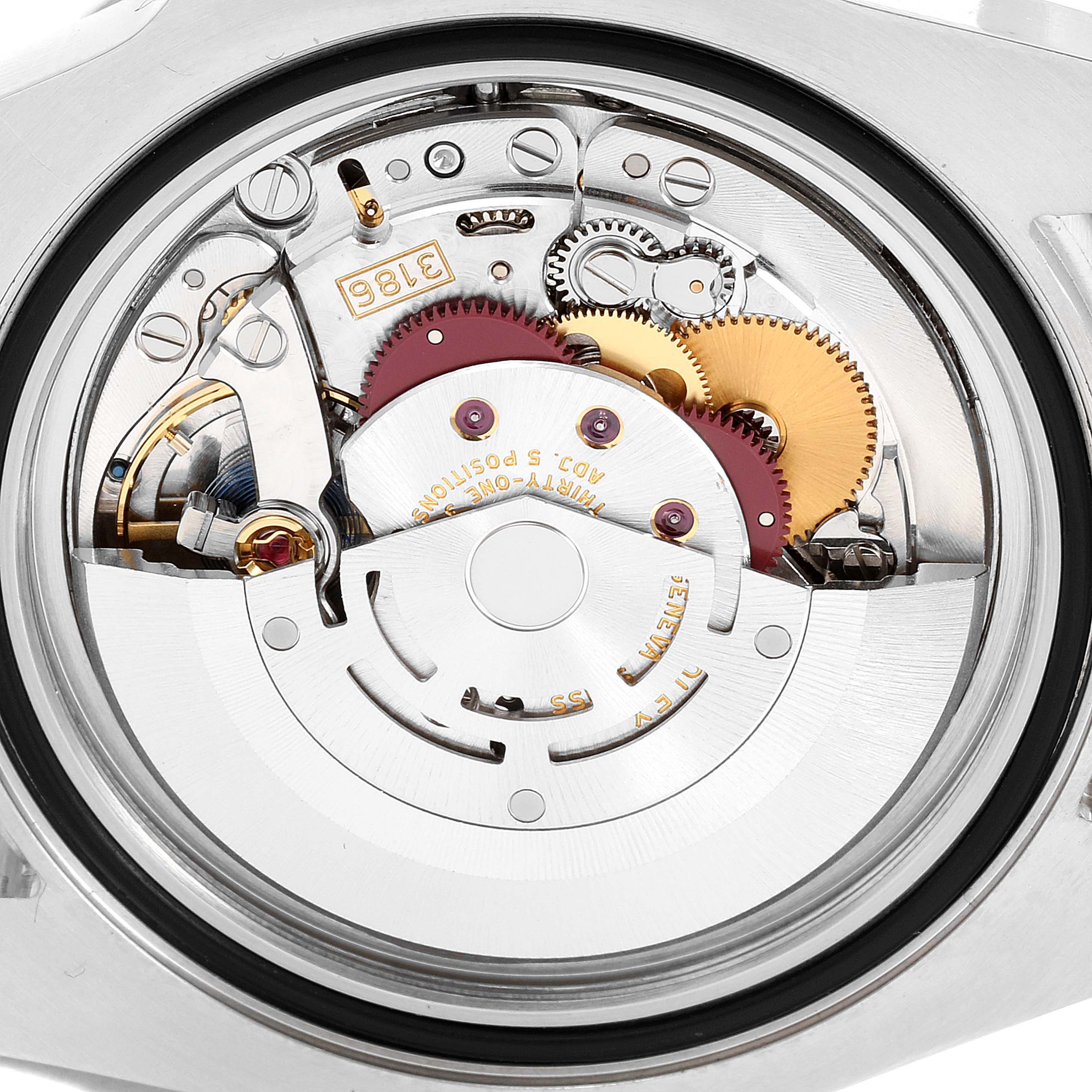 The image shows the back view of the Rolex GMT-Master 116713 Men's Steel and Gold (two tone) Black Dial 116713 Men's Steel and Gold (two tone) Black Dial, highlighting its intricate movement and internal gears.