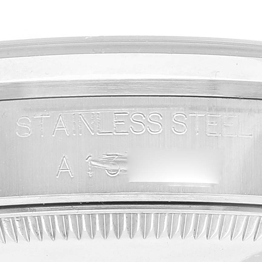 The image shows a close-up view of the outer casing and bezel teeth of a stainless steel Rolex Mid-Size 68240 Women's Stainless Steel White Dial 68240 Women's Stainless Steel White Dial watch.