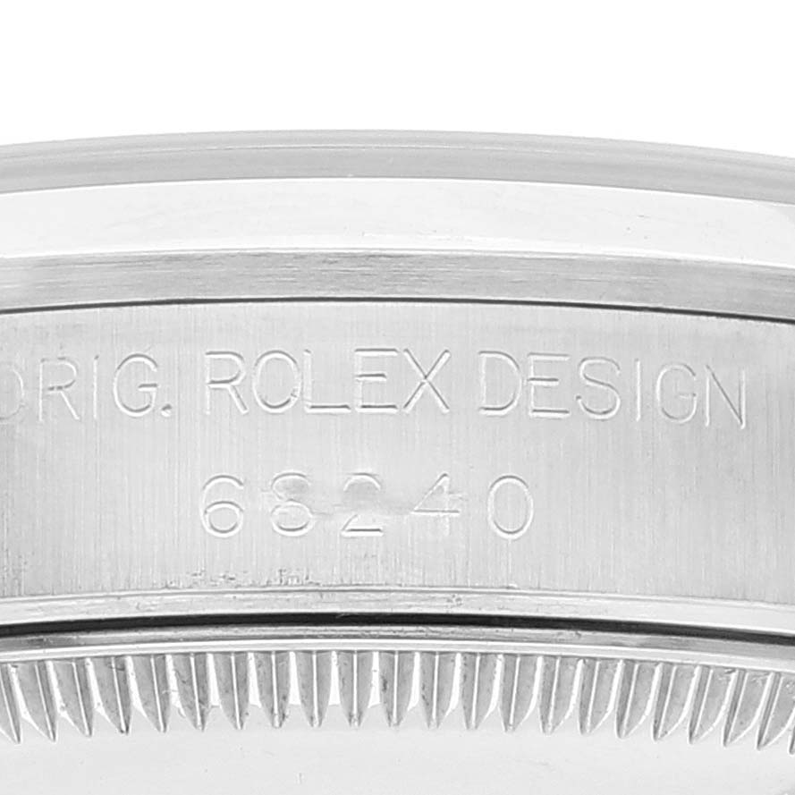 Close-up of the Rolex Mid-Size 68240 Women's Stainless Steel White Dial 68240 Women's Stainless Steel White Dial model 68240 showing the bezel, case, and engraved reference number.
