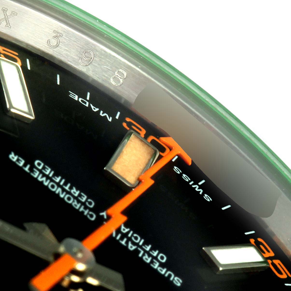 The image shows a close-up of the dial and second hand of a Rolex Milgauss 116400GV Men's Stainless Steel Black Dial 116400GV Men's Stainless Steel Black Dial watch with visible details of the indices and text.
