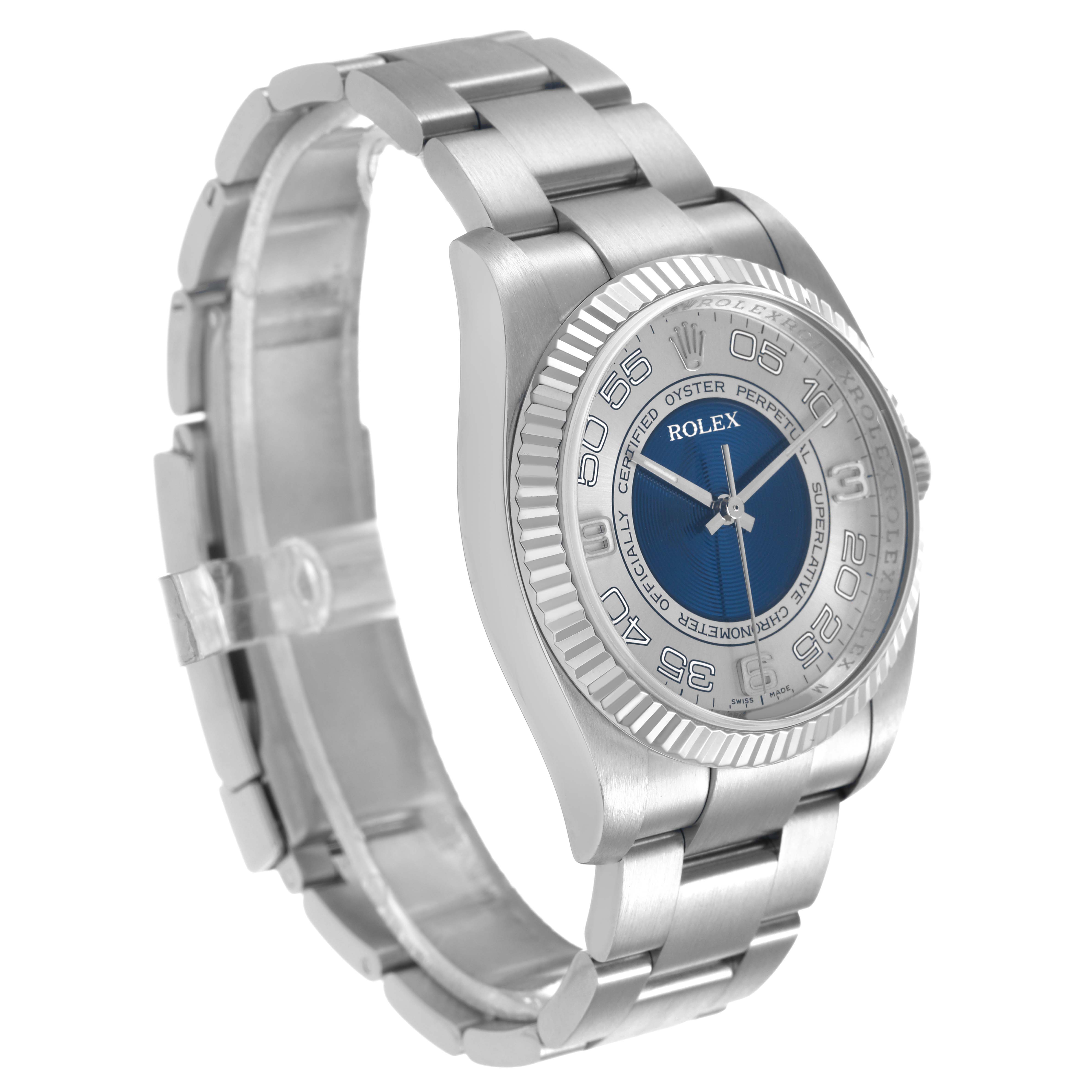 The Rolex Oyster Perpetual 116034 Men's Stainless Steel Blue Dial is shown from an angled side view, highlighting the bezel, face, and part of the bracelet.