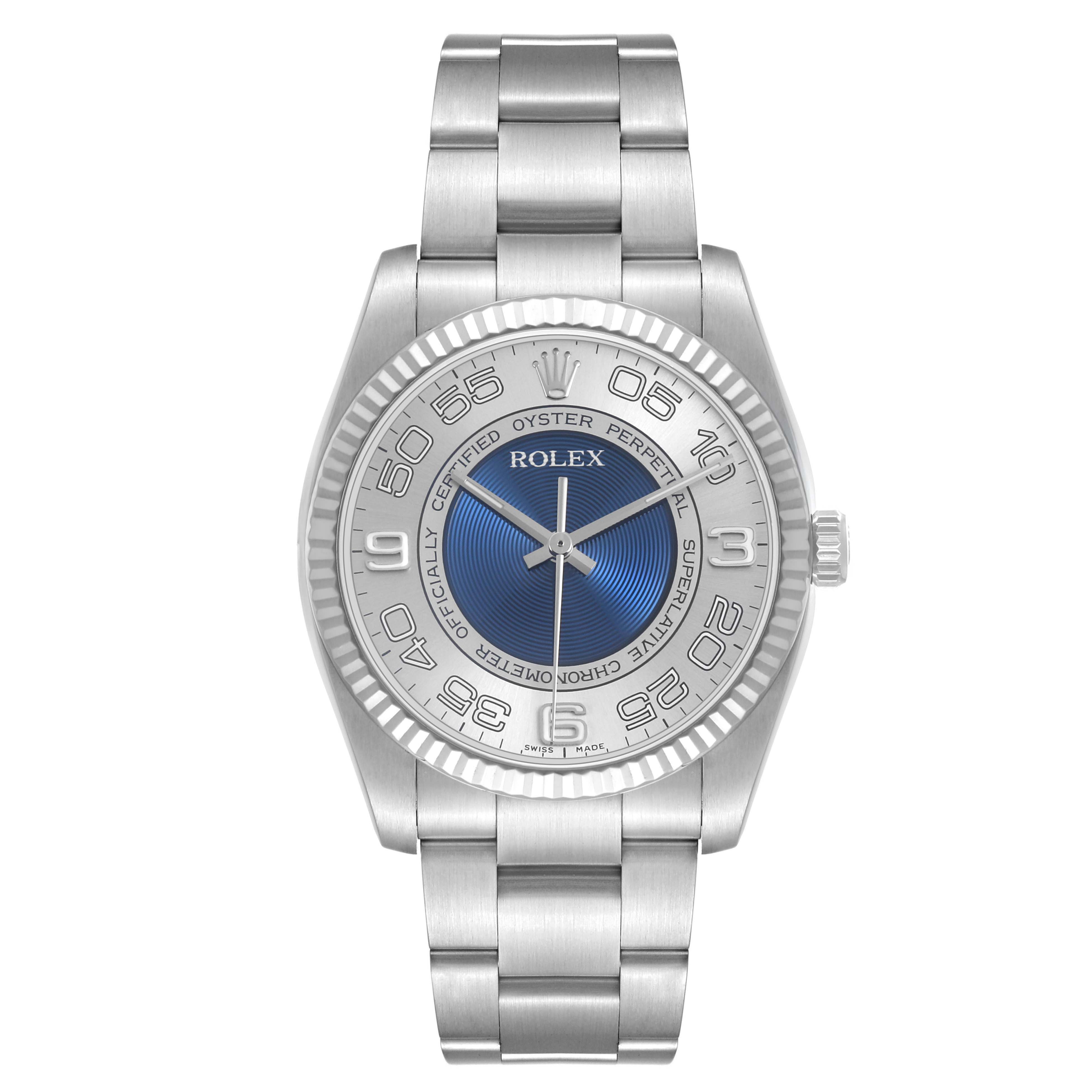 The Rolex Oyster Perpetual 116034 Men's Stainless Steel Blue Dial watch is shown from a top-down view, highlighting the bracelet, bezel, and face.