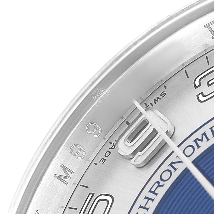 The image shows a partial close-up of the Rolex Oyster Perpetual 116034 Men's Stainless Steel Blue Dial watch dial, highlighting numerals and the edge of the bezel.