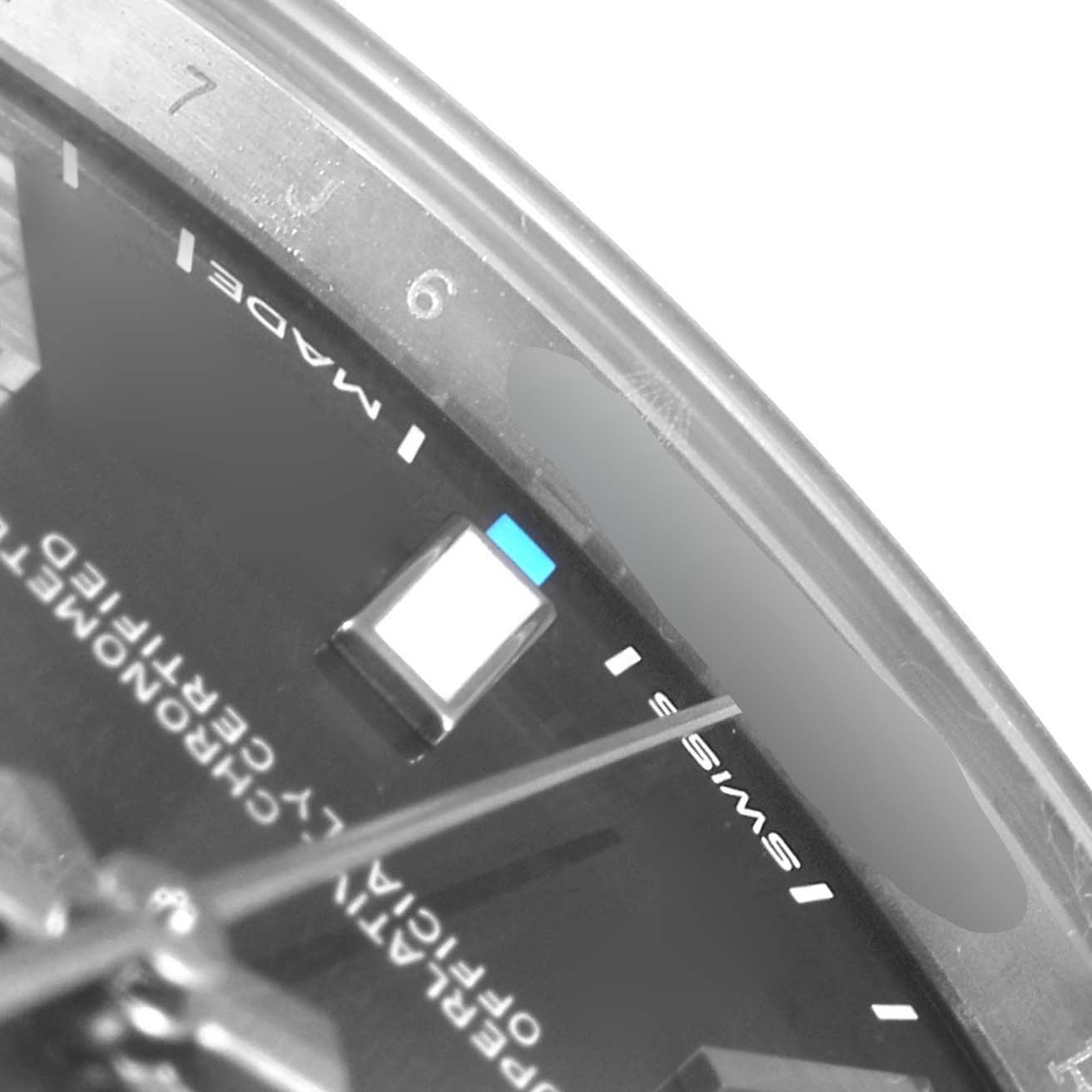 Close-up angle showing part of the dial, markers, and part of the hands of a Rolex Oyster Perpetual 114300 Men's Stainless Steel Silver Dial 114300 Men's Stainless Steel Silver Dial watch.