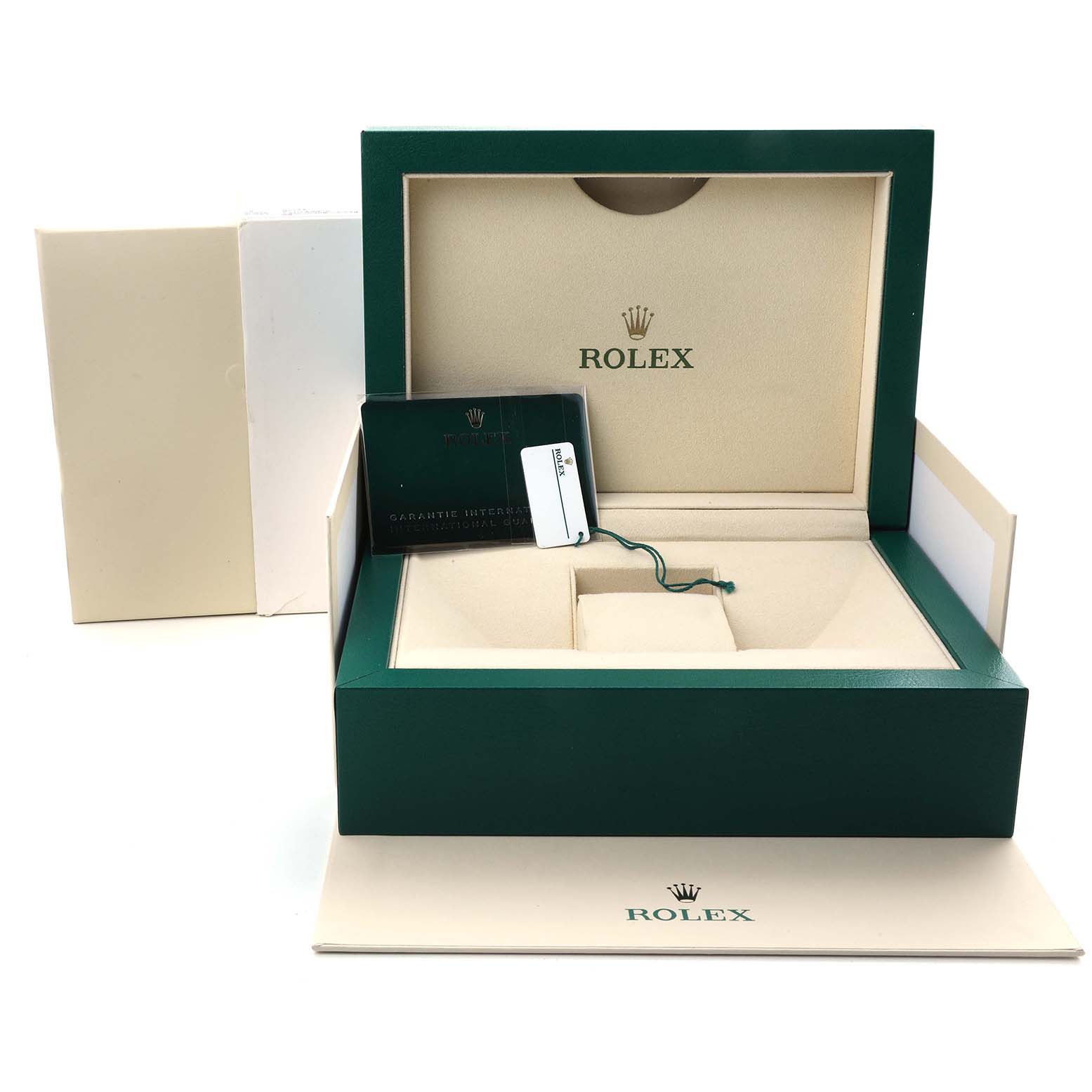 The image shows a Rolex Oyster Perpetual 124300 Men's Stainless Steel Silver Dial box set with a guarantee card and tag, taken from a slightly elevated front angle.