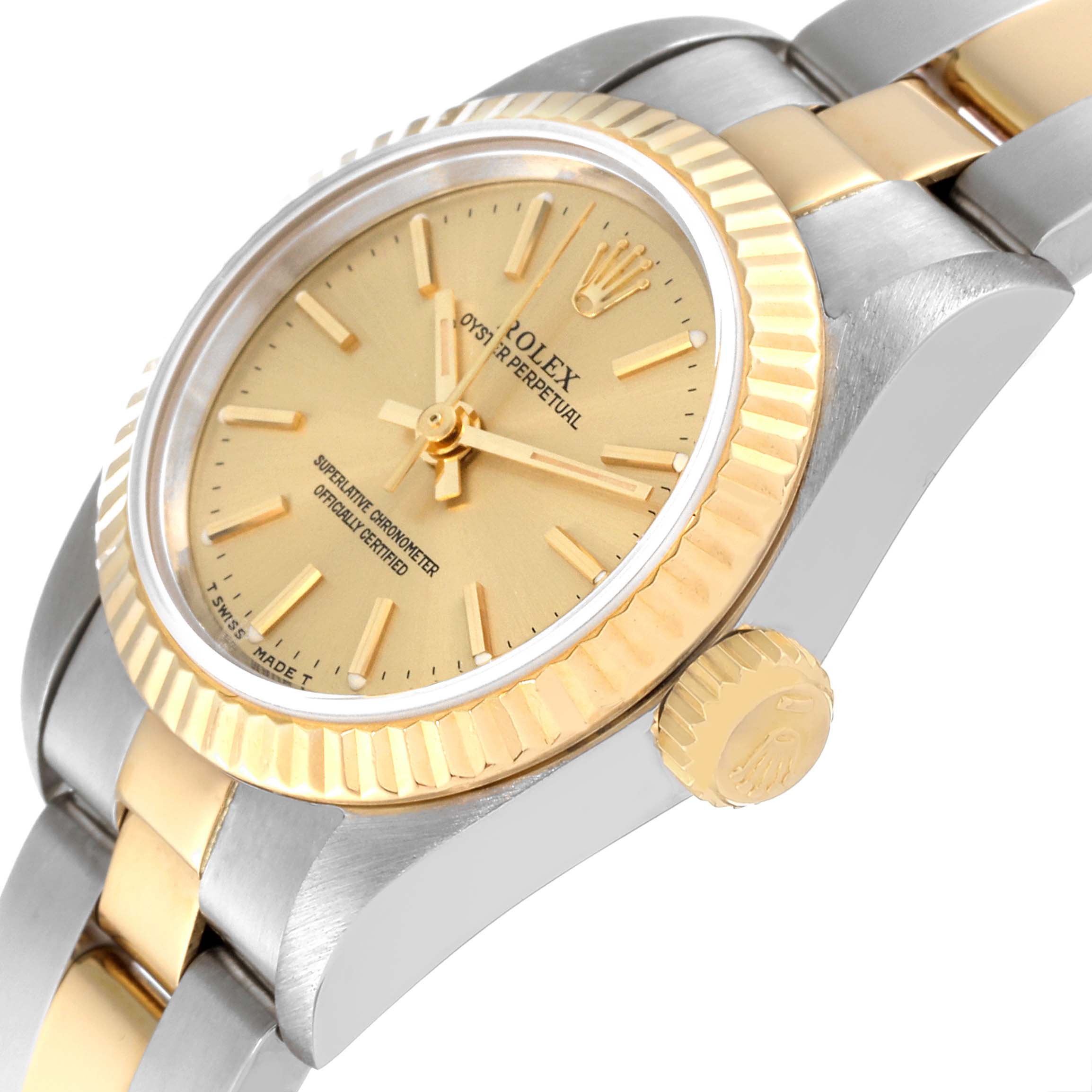 This Rolex Oyster Perpetual 67193 Women's Steel and Gold (two tone) Champagne Dial 67193 Women's Steel and Gold (two tone) Champagne Dial watch is shown at an oblique angle, highlighting its dial, bezel, crown, and bracelet.
