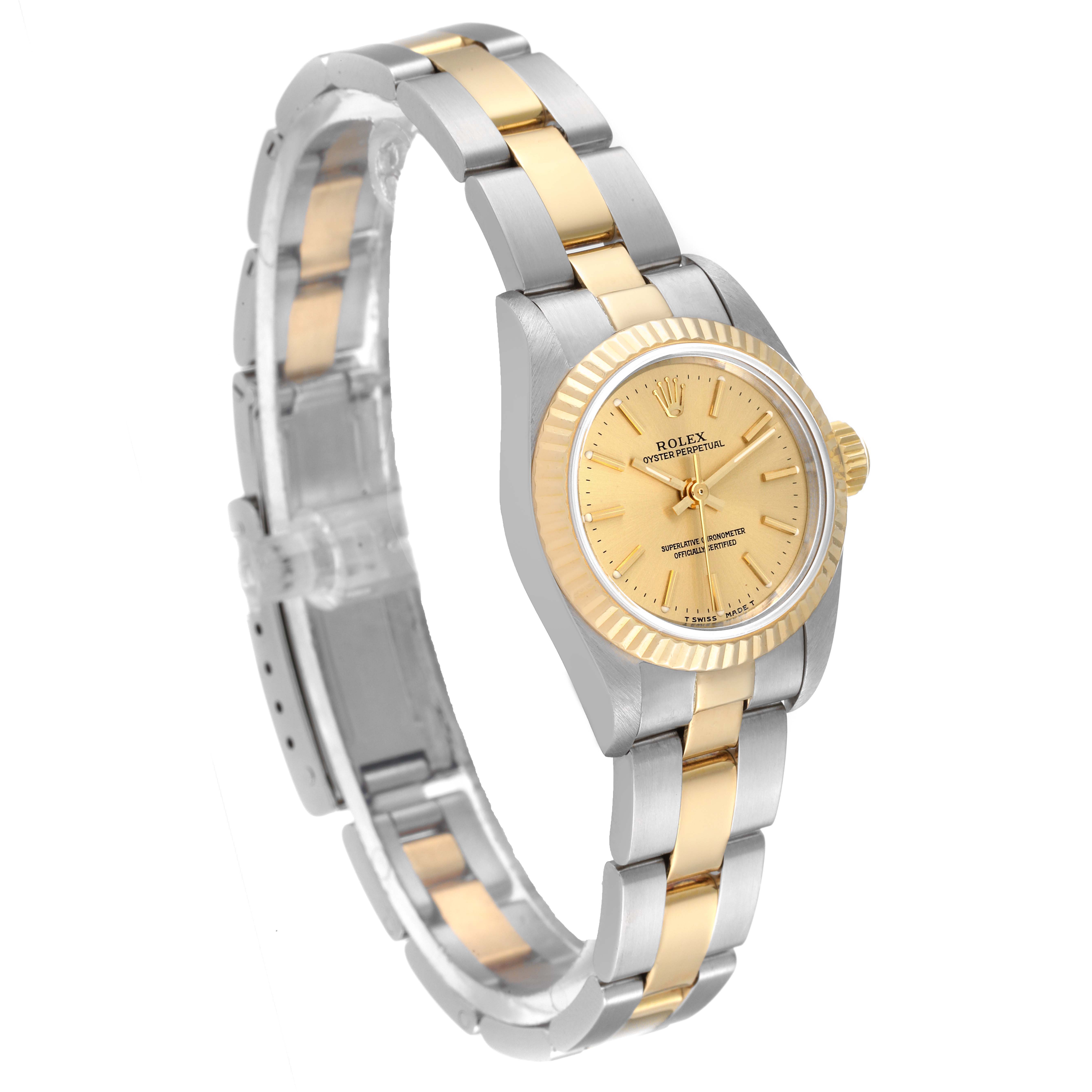 This is a top-left angled view of a Rolex Oyster Perpetual 67193 Women's Steel and Gold (two tone) Champagne Dial 67193 Women's Steel and Gold (two tone) Champagne Dial watch showing the face, bezel, case, and bracelet.