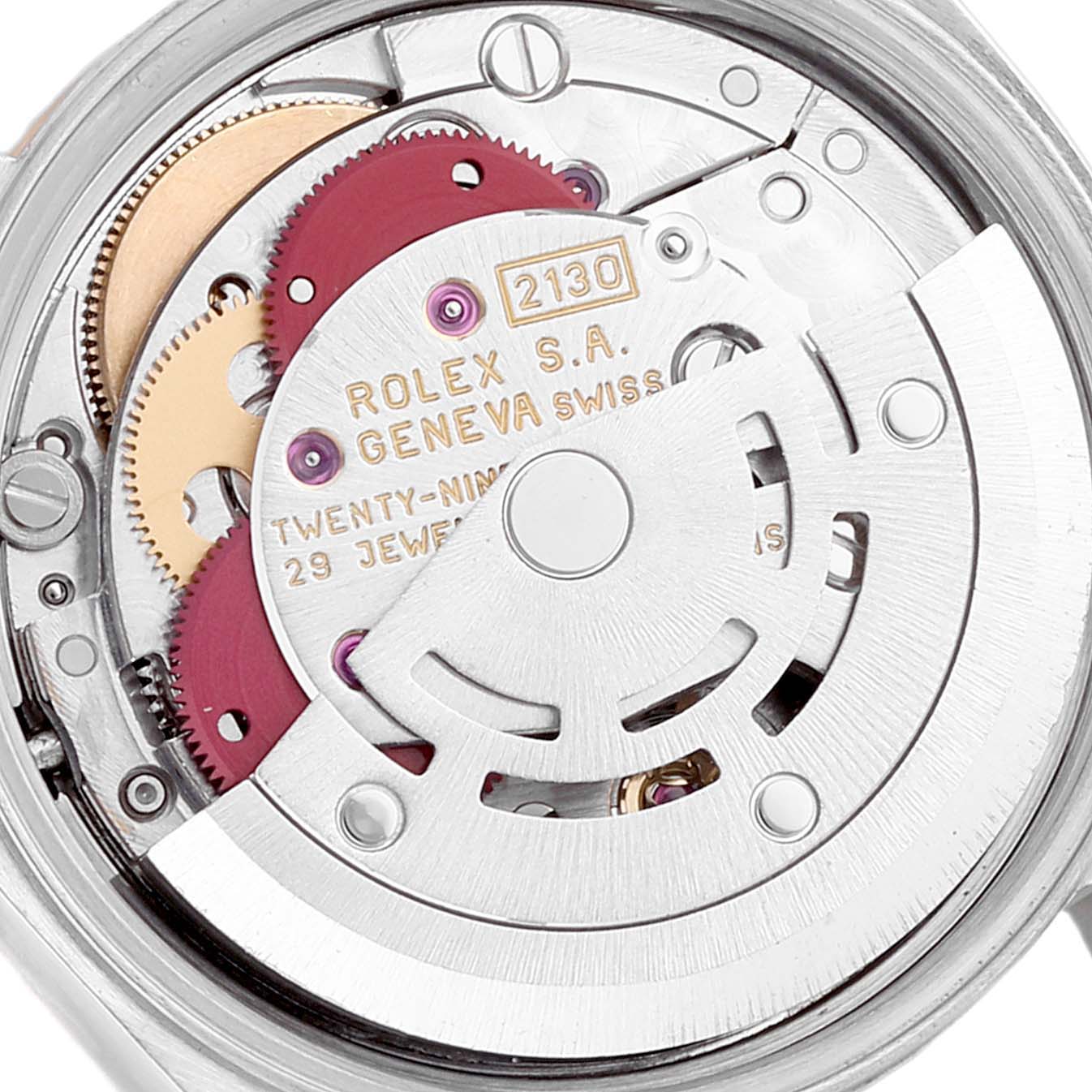 This image shows a close-up of the movement of a Rolex Oyster Perpetual 67193 Women's Steel and Gold (two tone) Champagne Dial 67193 Women's Steel and Gold (two tone) Champagne Dial, highlighting the intricate gears and components.