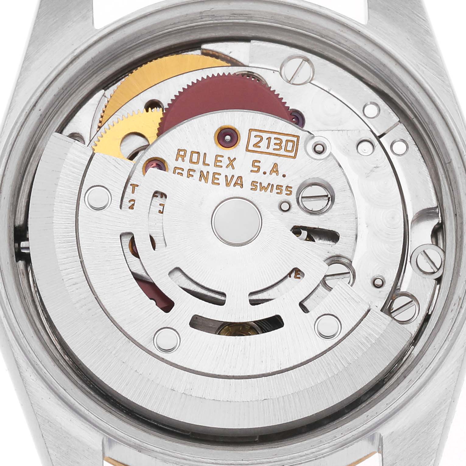 The image shows the movement of a Rolex Oyster Perpetual model 67193 men's watch, viewed from the back, highlighting its internal mechanisms and rotor.