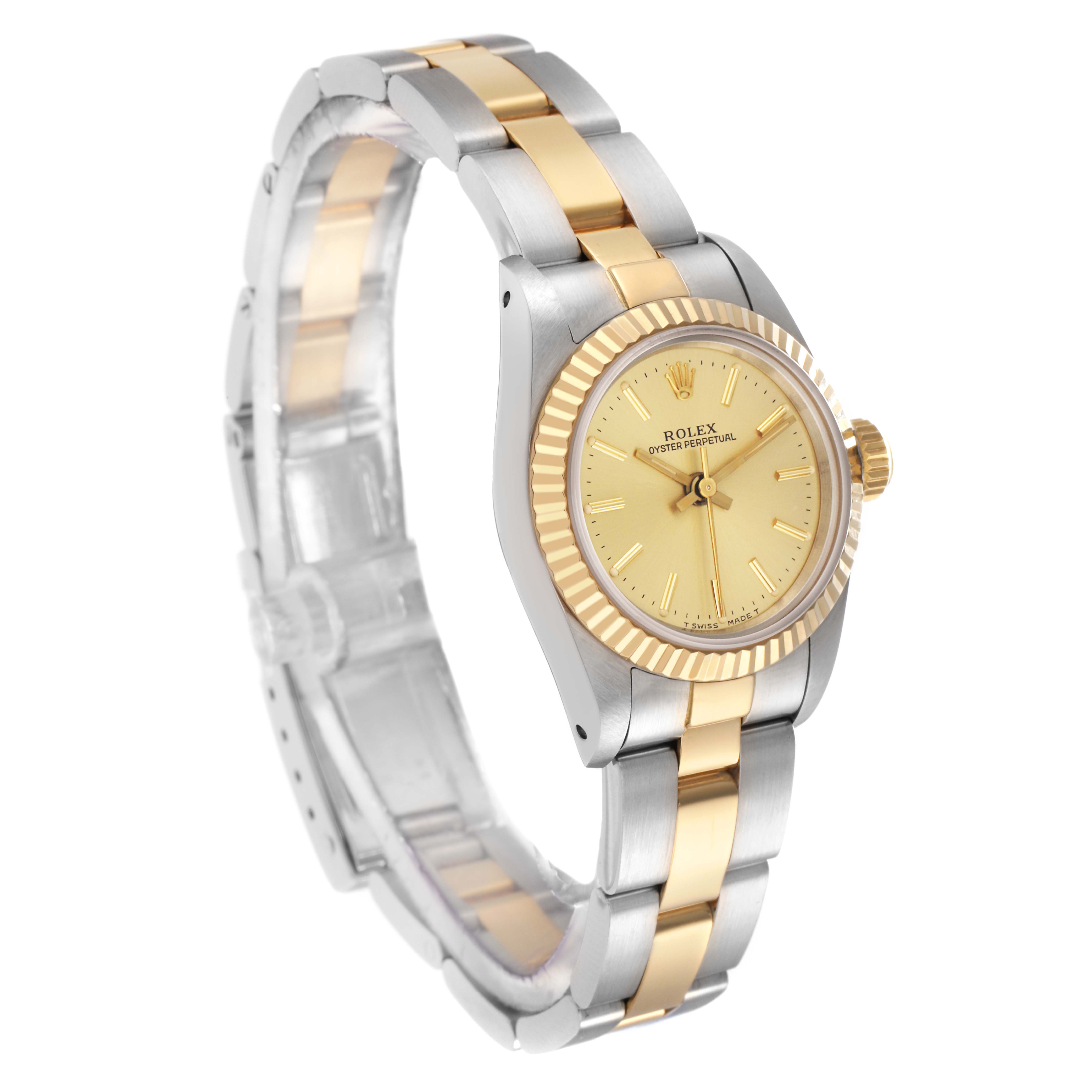 The Rolex Oyster Perpetual model 67193 is shown at a three-quarter angle, highlighting the gold and silver bracelet, fluted bezel, and yellow dial.