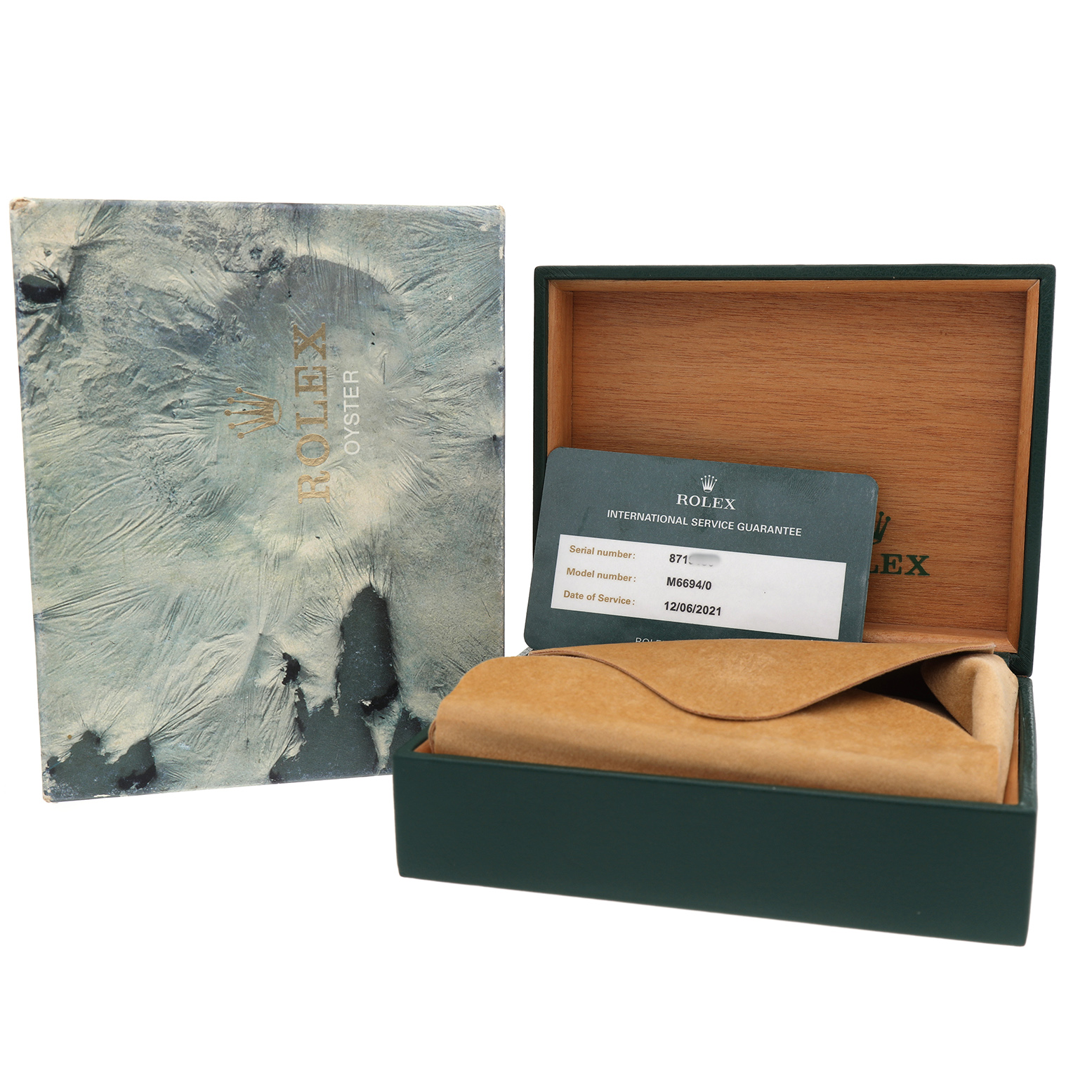 The image shows the Rolex Date 6694 Men's Stainless Steel Silver Dial watch's box, an international service guarantee card, and a protective pouch.