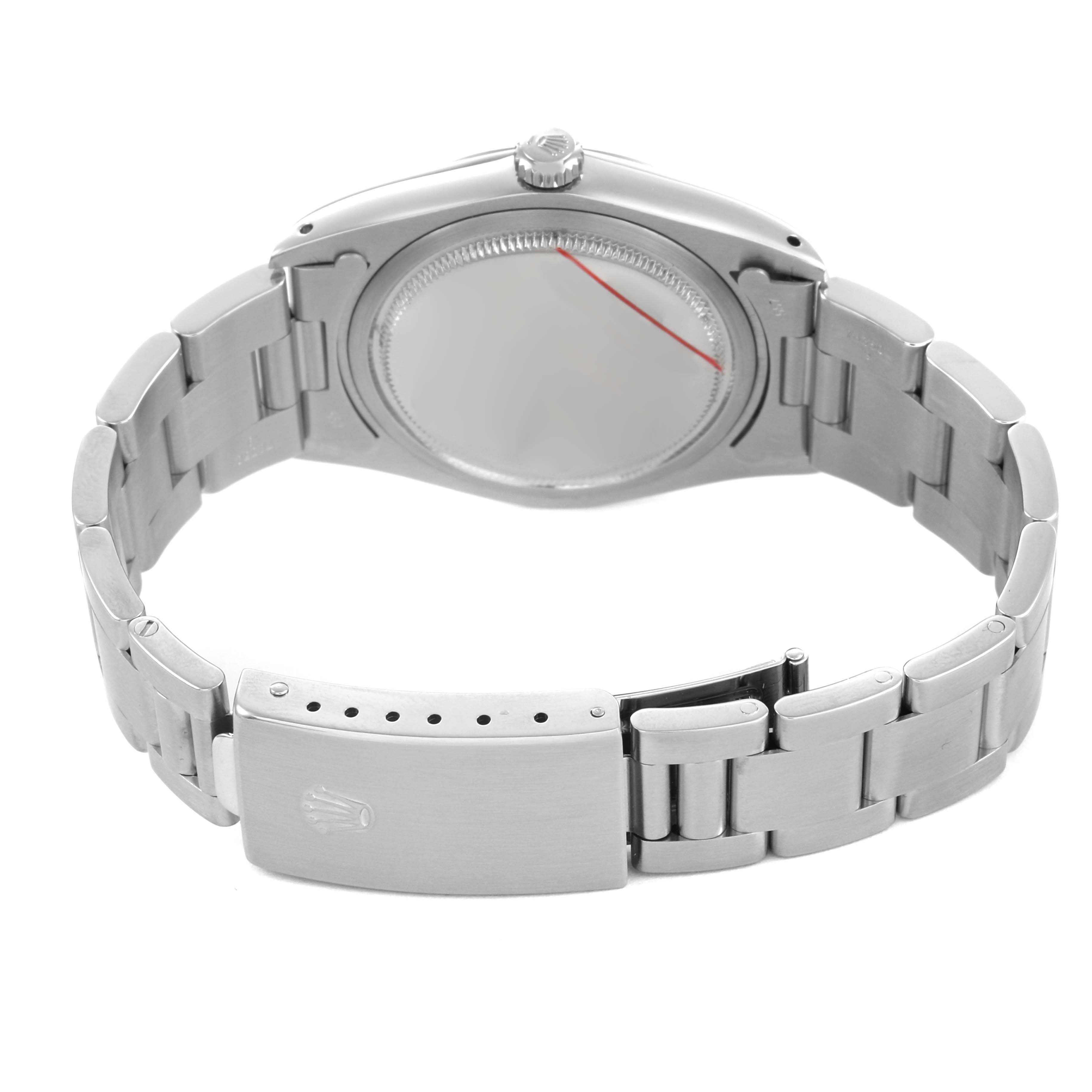 The image shows the back view of a Rolex Date 6694 Men's Stainless Steel Silver Dial watch, highlighting the clasp, bracelet, and case back.