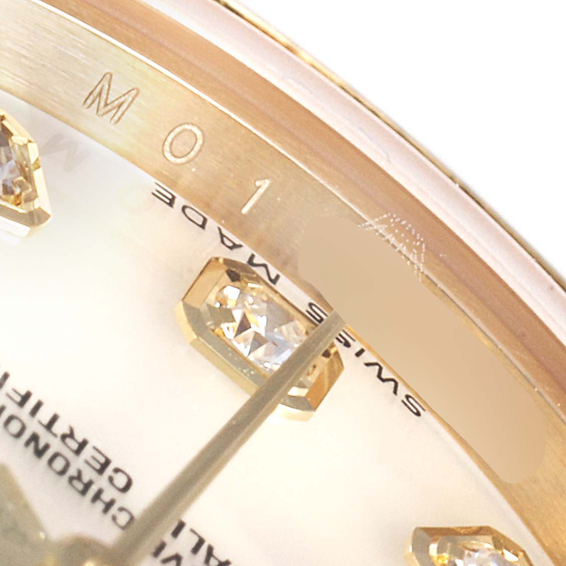 This image shows a close-up of the dial, diamonds, and part of the bezel of a Rolex Pearlmaster 80298 Women
s Yellow Gold Mother of Pearl Dial 80298 Women
s Yellow Gold Mother of Pearl Dial watch.