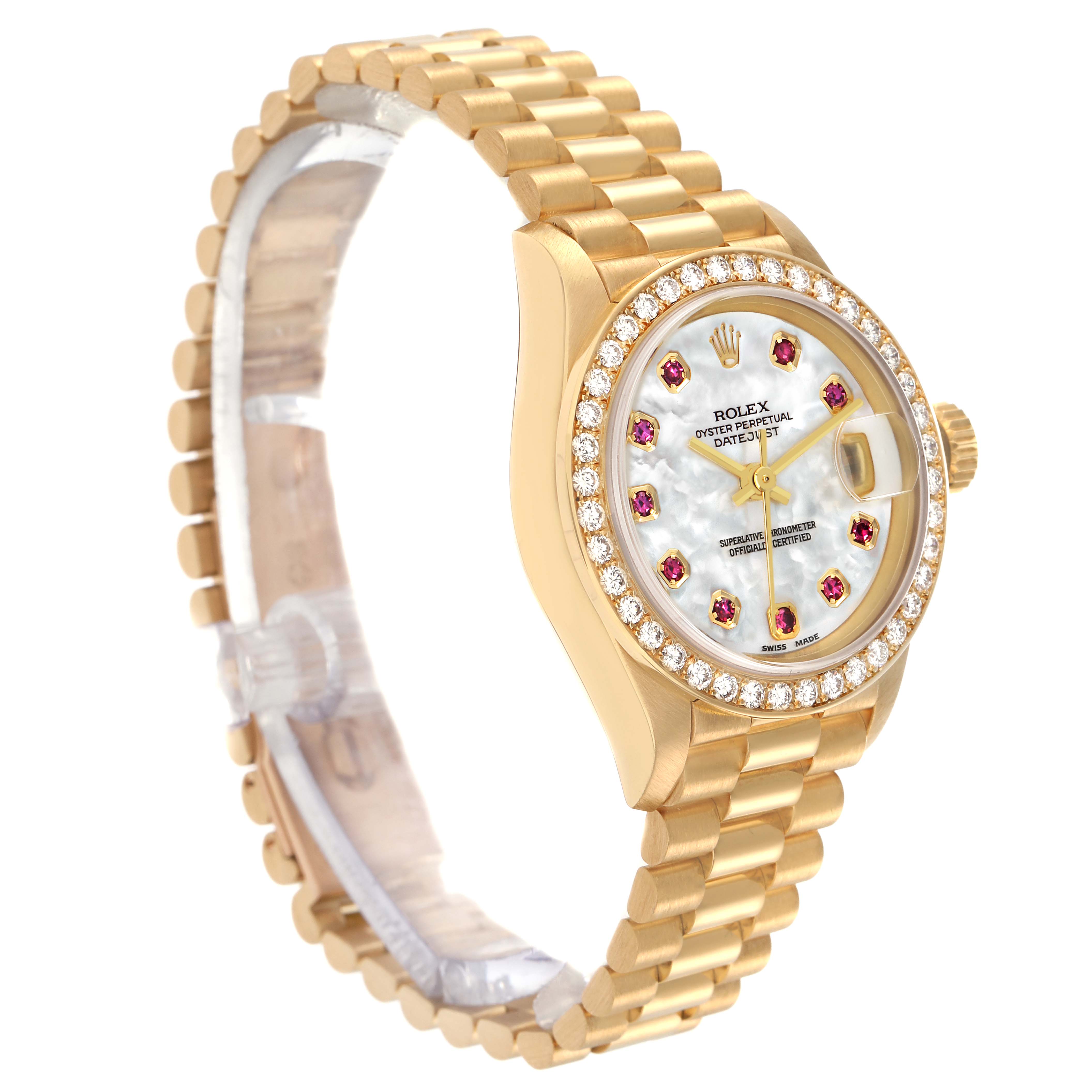 The Rolex President model 69138 is shown at a slight angle, highlighting its luxurious bracelet, diamond bezel, and ruby-accented mother-of-pearl dial.