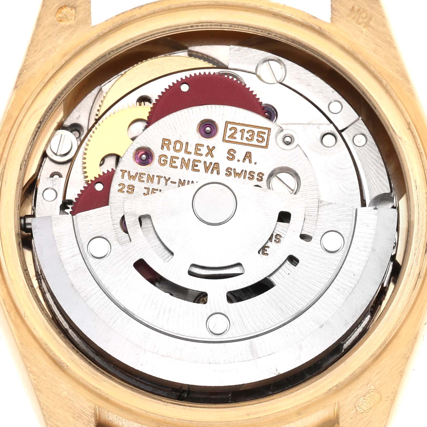 The image shows the movement from the back of a Rolex President 69138, displaying gears, a rotor, and inscriptions.