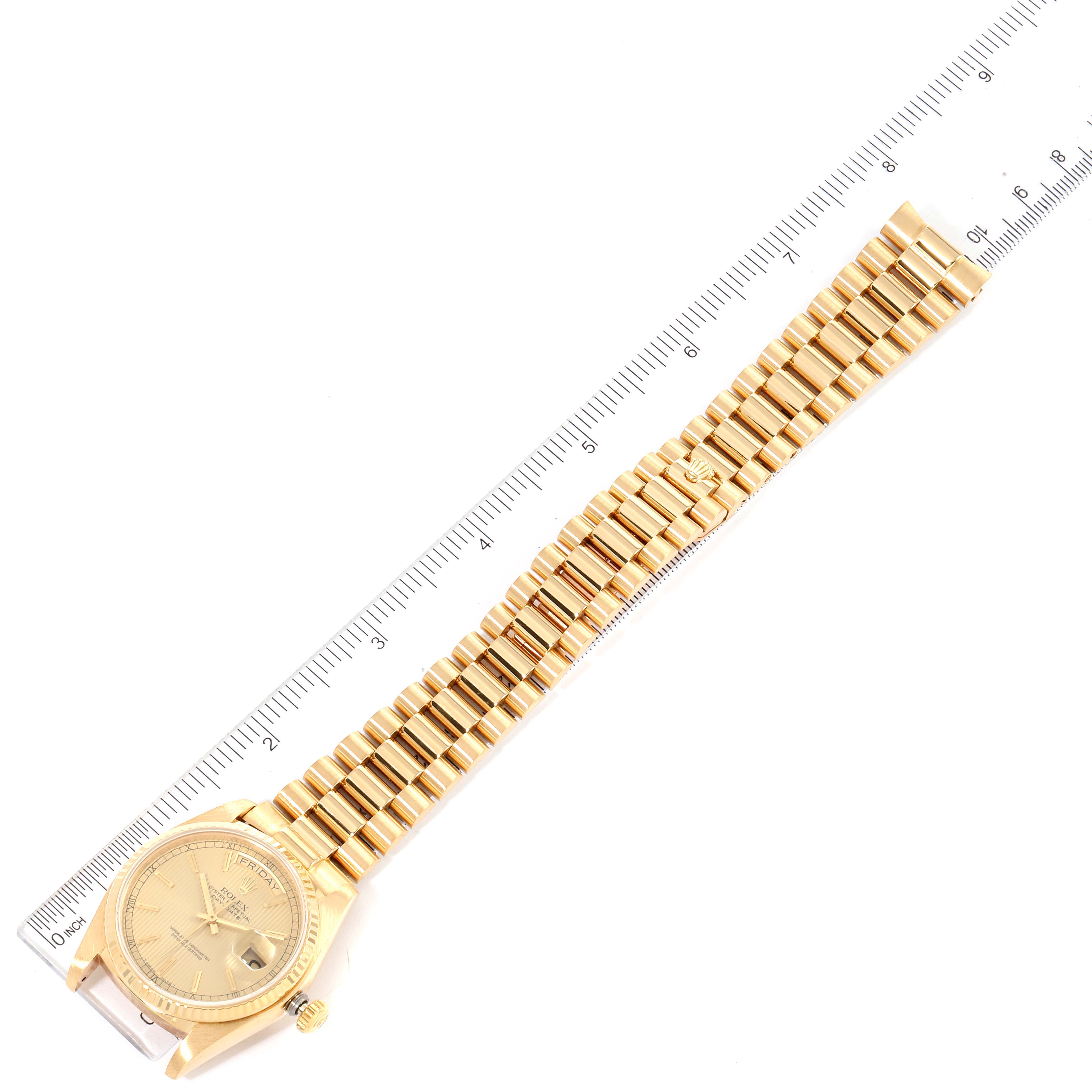 The image shows a top-down view of a Rolex President 18038 Men's Yellow Gold Champagne Dial 18038 Men's Yellow Gold Champagne Dial watch with a gold bracelet alongside a ruler for scale.