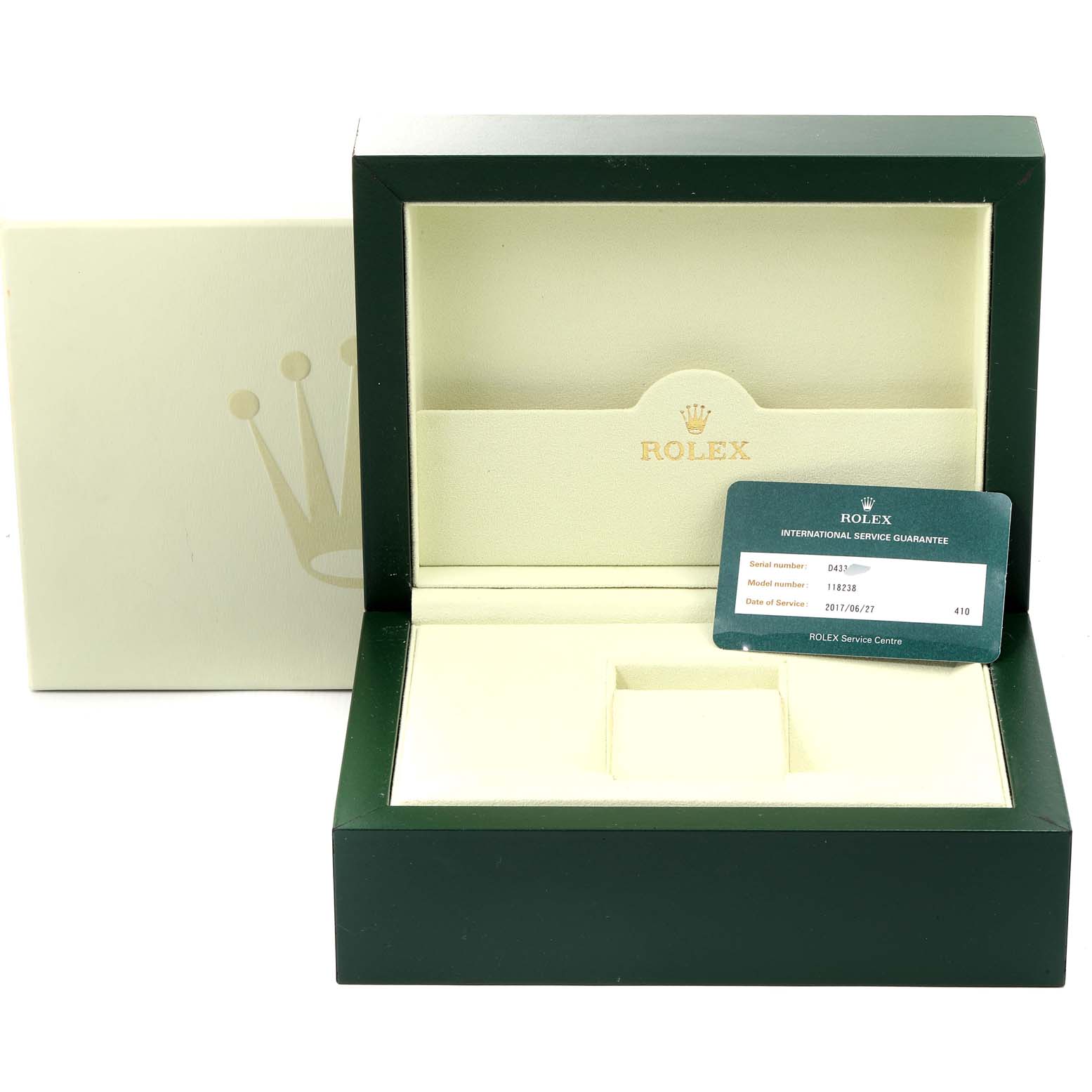 The image shows an open Rolex President 118238 Men
s Yellow Gold Black Dial 118238 Men
s Yellow Gold Black Dial model watch box with an international service guarantee card.