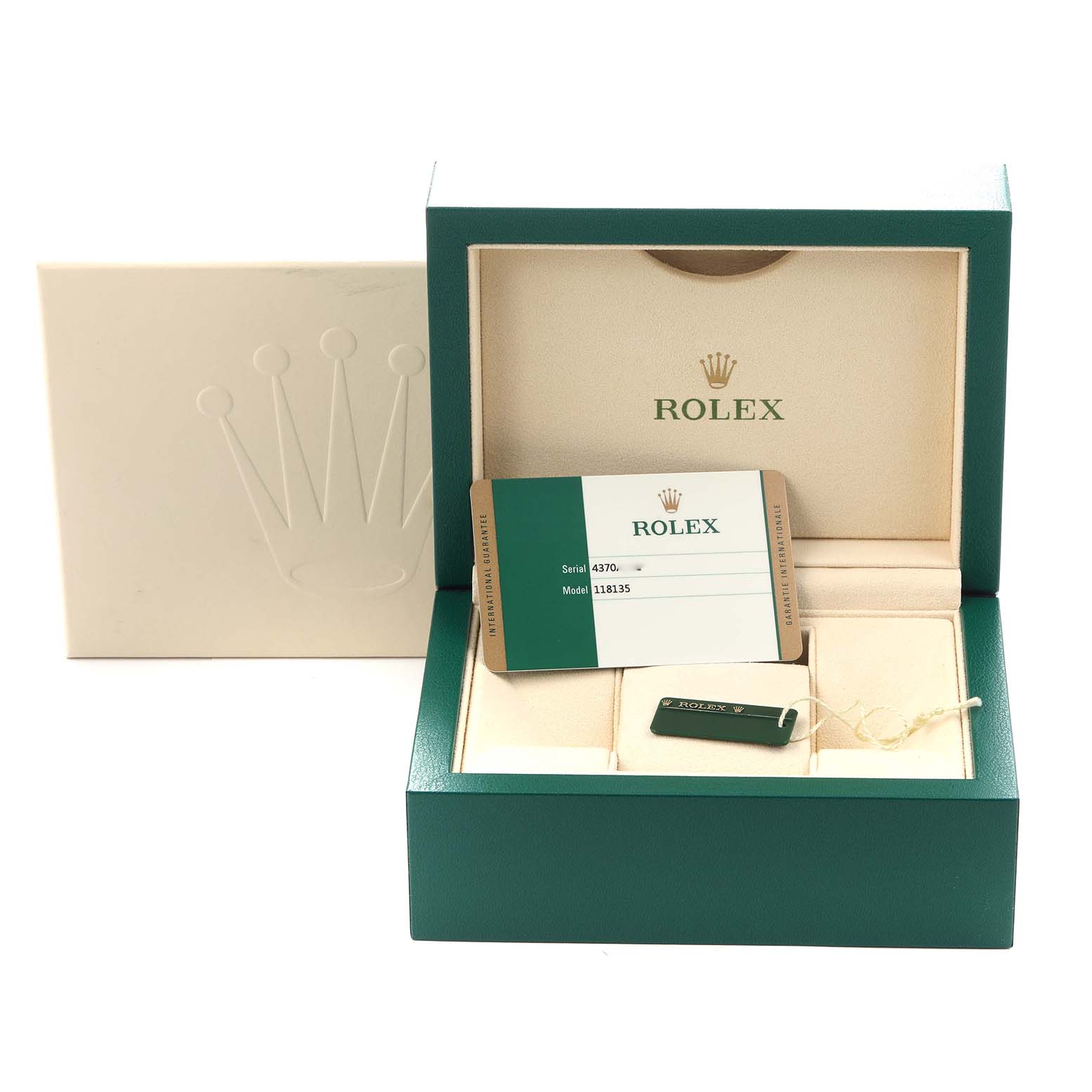 The image shows a Rolex President model 118135 men's watch box with a warranty card and tag inside the green case.
